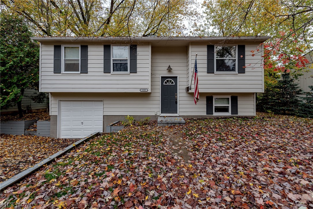Phenomenal opportunity for your next home in Kent! This charming home features an open layout, an eat-in kitchen, and spacious bedrooms. All that is missing is you! Beautiful wood-look floors greet you in the living room and flow into the kitchen. The kitchen features all appliances, a breakfast bar, and a sunny eat-in area with deck access, perfect for enjoying summer cookouts! Three spacious bedrooms and an updated full bathroom complete the first floor. The lower level includes a spacious family room with ground level windows, a laundry area, and garage access. Outside, there is an attached 1 car garage and a large deck that overlooks the backyard. Located off of Silver Meadows Boulevard, this home is just minutes away from area parks, Jessie Smith Nature Preserve, area shopping, and dining destinations.  Do not miss out on this opportunity to own a delightful home in a prime location!