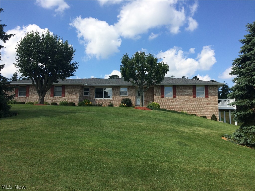 Lovely all brick ranch home on 7+ acres! You will appreciate the meticulous care and attention this home has received over the years!  New carpet in the dining room and living room!  Plus, the double sided fireplace adds instant ambience to any family meal in the dining room!  A nice eat in kitchen offers a view of the country side.  Or enjoy the privacy of the covered back  patio off the dining room.  The master suite has a full master bath and its own private deck (trex decking, vinyl railing) !  A walk out basement has a nice office area, a wet bar for entertaining, and a spacious family room!  You will find plenty of storage in this clean, clean, home!  Do not miss this one!