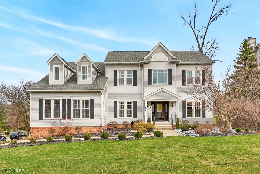 Welcome to 7582 Wilton Ln. in beautiful South Hampton Woods, a spacious 4-5 bedroom, 4 full bath gem with a finished walk-out basement, 10’ ceilings, abundance of natural light and stunning views of the wooded back yard.  Enter to the 2-story foyer and dining room with hardwood flooring and large windows overlooking the front yard. French doors lead to the den or office off the family room. The family room is warm, inviting and openly flows to the kitchen with granite counters, breakfast bar and ample space for a kitchen table which overlooks the beautiful back yard perfect for family gatherings. Sliders open from the kitchen to the large upper deck with steps to the lower level deck and a gravel patio. A sprawling bonus room is located off the kitchen [currently the first floor primary bedroom] with adjoining full bath and more large windows. On the second floor, also with 10’ ceilings, are four bedrooms including the generous primary bedroom and en suite bath. The enormous finished walk-out basement adds even more space and opportunity with a gas fireplace and full bathroom. Sliders open to the lower deck, gravel patio and fire pit area all nestled into the natural park-like setting, perfect for family and entertaining. Welcome home!