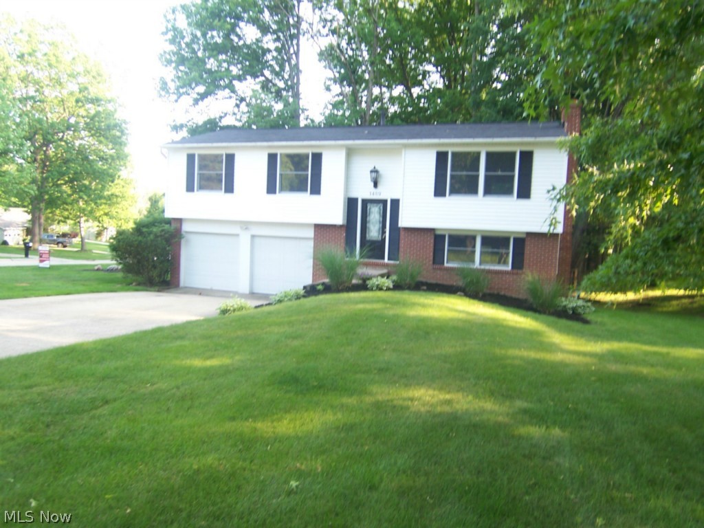 An open and updated Bi-Level with walk out lower level in the heart of Stow.  This 3 bedroom 2 full bath home has an updated, open kitchen with newer cabinets, granite counter top, wood floors, formal dining, and lighting to impress anyone.  Both bathrooms are fully updated.  The roof is newer, with vinyl siding in 2013, furnace in 2009, and many more updates.  The large living room is bright and open.  The finished lower level features a bar and fireplace.  There is an attached 2 car garage, deck, a master suite, and so much more.