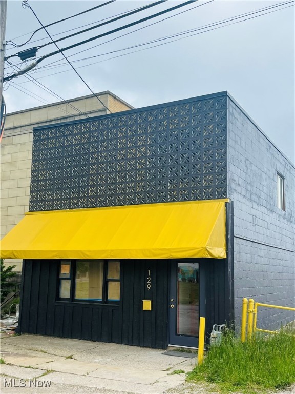 Here's an exciting opportunity for all business owners and investors.  A unique, mid century breeze block building fully restored to glory.  Much of this property was taken down to the studs.  New commercial roof, fresh exterior paint, almost EVERYTHING new on the inside.  This Commercial two story cinder block and I-beam constructed structure will last another 100+ years.  The exterior has been completely revamped with fresh paint all around giving it excellent curb appeal.  The second level offers a renovated two bedroom apartment with brand new bathroom and kitchen.  There are fantastic views of the Historic downtown area of Lorain as well as the Black River.  The lower level is perfect for retail storefront or a BNB.  Infinite street parking and a desirable location to enjoy city life.  Its walking distance to beautiful Lake Erie, Black River, shopping, churches, schools, restaurants, theater and so much more. Be a part of the action at a competitive price before it's too late.