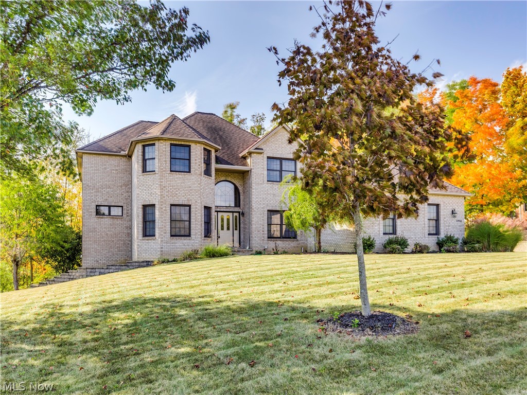 Welcome to this full brick front Colonial with 3-car side entry garage featuring brand new furnace & A/C in the fall of 2019. Situated on a rolling, wooded lot that backs up to green space. The open floor plan with 2-story foyer leads to the dining room and den on either side.  The first floor master bedroom w/walk-in closet and en suite bath w/large jacuzzi tub. Family room w/fireplace and spacious kitchen w/bayed eating area, center island and a first floor laundry room complete the first floor. Possible 2nd floor master/guest bedroom w/full bath. 3 additional bedrooms and a Jack and Jill bathroom are also on the 2nd floor. Most bedrooms have walk-in closets. New carpet in first floor master and entire 2nd floor. 14-course basement. Home Warranty.