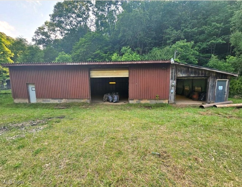Conveniently located 3-bay garage/workshop setup just a few miles outside the heart of Spencer, WV in Roane County. Property includes one large building and one smaller building with a combined 1,360 sq ft of workspace. Both buildings have electric and concrete floors, with the larger building featuring floor drains for easy cleanup. Plenty of parking space on-site—ideal for storage, auto work, hobbies, or a small business.