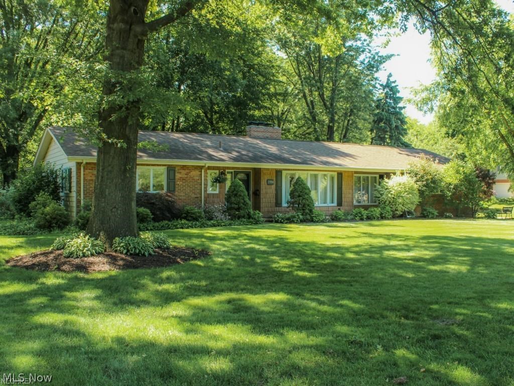 Look no further Ranch buyers!  This is the one you have been waiting for.  Totally custom and undated Ranch in beautiful Silver Lake Ohio.  This well cared for home is loaded with charm and character that starts on the outside.  The extensive list of upgrades includes the professionally landscaped yard with a beautiful covered patio and outdoor sitting room to have your morning coffee.  There is a custom made barn in the yard wired with electric, an electric underground dog fence, underground utilities and irrigation well.  Newer water softener. This home also features an open family room connected to a custom cherry cabinet kitchen and gorgeous entertainment center with Bose audio system throughout the kitchen and family room.  Beautiful hardwood flooring, 3 fireplaces, two with custom made mantels.  Awesome updated main bath with whirlpool tub and glass surround shower.  Ceiling fans throughout.  One bedroom converted to "closetmade" walk in closet and another with built in ceiling t