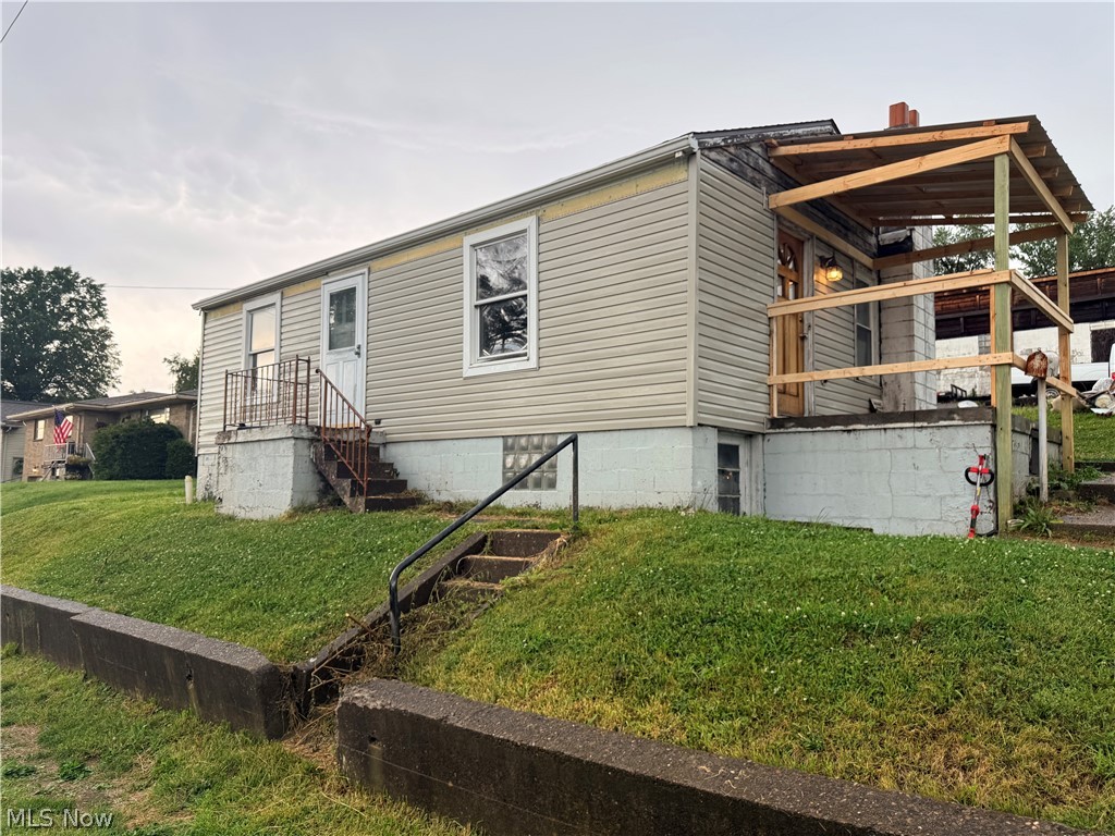 Opportunity awaits with this fixer-upper situated on a desirable corner lot in the heart of Mingo Junction! 2 bedrooms with new carpet, new Bathroom currently being installed. Whether you’re an investor, flipper, or buyer looking to create your dream home, this property offers incredible potential and a chance to build equity. Featuring a convenient location close to schools, parks, shopping, and local amenities, this home is ready for your vision and updates. The spacious lot provides ample outdoor space for future improvements, landscaping, or additional parking. As an added bonus, mineral rights owned by the seller will convey with the sale. Don’t miss this affordable opportunity to transform a property with great possibilities into something truly special! FUll mechanics 2 car garage on the property and large Pole Barn which will require new roof.