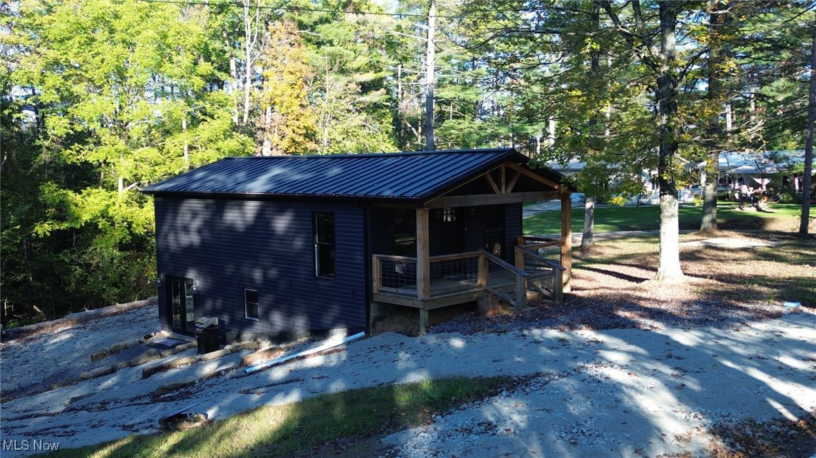 This charming single-family home located at 4544 Beach Road in Glouster, OH was built in 1965 and completely renovated in 2024 offers a cozy and inviting living space. Currently being used as a short term rental with documentation of last years income. Features 2 bathrooms and 3 bedrooms and 1,380 square feet of finished area, this two-story home sits on 2 lots at Burroak state Park. The property has been completely renovated with new electrical plumbing and HVAC with additional living space added. The main level features a  kitchen, bar area, and one bathroom, while the upper level houses three bedrooms a living area and an additional bathroom.  The home offers ample space for comfortable living and entertaining. The expansive lot provides plenty of outdoor space for recreation and relaxation. With its convenient location in Glouster, and Burroak state park and lake residents can enjoy the tranquility of rural living while still being close to nearby amenities and attractions. Whether you're looking for a cozy family home or a peaceful retreat or income property, this property offers the perfect blend of comfort and convenience. Don't miss out on the opportunity to make this lovely home yours.
