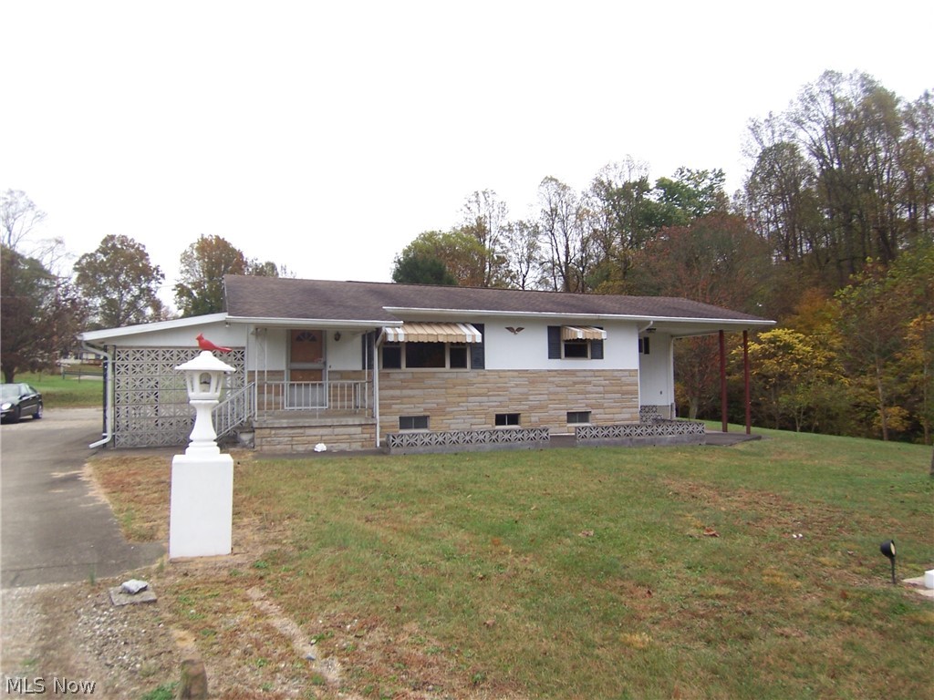 Location, location, location - 5 minutes to town!  This is a great three bedroom, two full bath home with a large living room and partially finished basement.  It offers three garages, two carports all on 4-4.5 acres. Fantastic property in Reno!