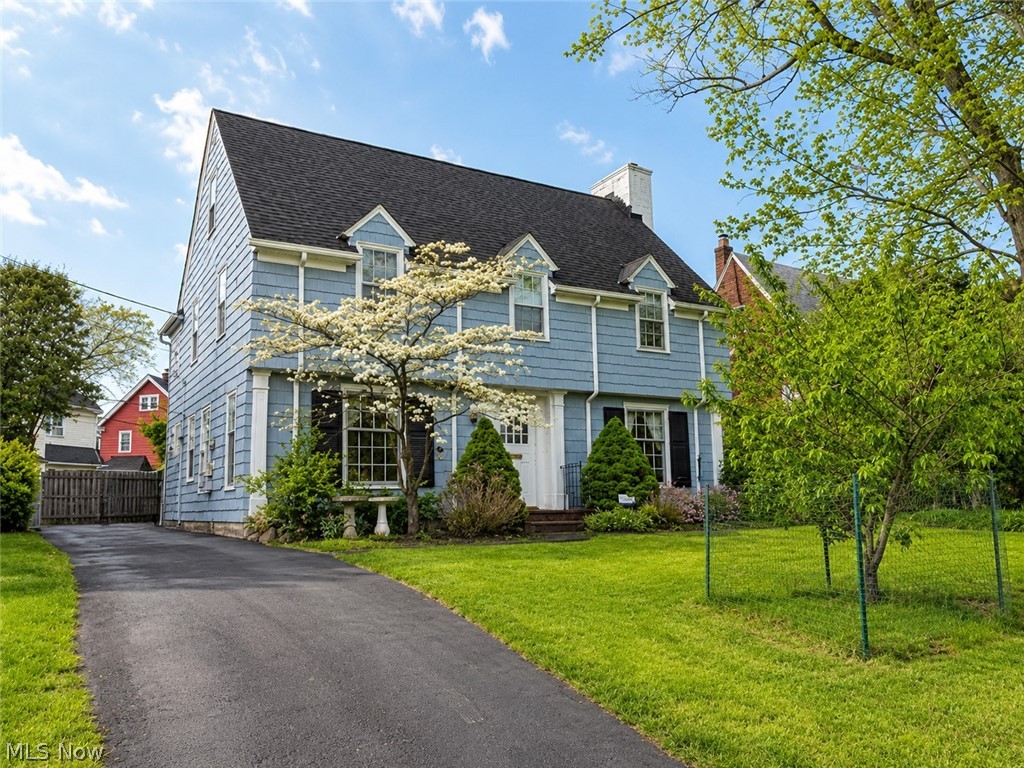Exceptional value in one of Shaker Heights’ most coveted neighborhoods,  2,244 sq ft, 5 bedrooms and 3.5 baths in a landmark 1930 Fernway Colonial designed by the celebrated firm Nichols & Fritzsche. Rich original woodwork, gleaming hardwood floors, and the craftsmanship that defines Shaker Heights’ architectural legacy. The main floor is made for both gracious entertainment & everyday comfort. A center entrance foyer opens to a generous living room with a gas fireplace. Just beyond, a spectacular study/office tucked behind elegant French doors features built-in bookcases and a dramatic wall of windows that floods the space with natural light. A formal dining room and bright eat-in kitchen with a brand new floor complete the main level, along with a convenient half bath. Upstairs, four well-proportioned bedrooms include a master suite with Jack & Jill bath and three additional rooms served by a full hall bath. The third floor delivers a private fifth bedroom with its own full bath, ideal for guests, an au pair, or a home office plus a walk-in cedar closet and generous storage. The partially finished lower level adds a recreation room, dedicated laundry, workshop area, pantry/wine cellar, and abundant storage. Recent updates include a new kitchen floor, freshly painted interior and exterior, upgraded electrical panel, and newer boiler. Seller has addressed inspection safety items. All kitchen appliances remain. Detached 2-car garage. Shaker Heights POS compliant. Seller-offered home warranty. Steps from the newly rebuilt Fernway Elementary, close to Shaker Heights High School, parks, shopping, and transit. Rarely does this much home come available at this price point in Fernway, don’t miss it.