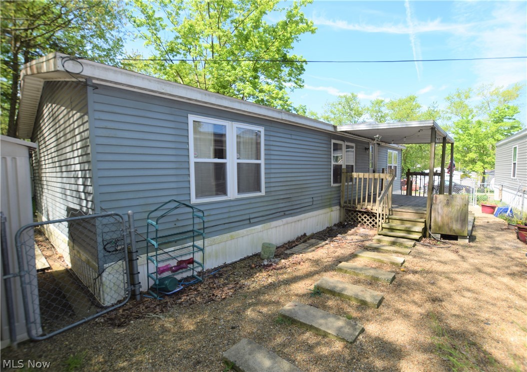 Welcome to 6236 Sue Lynn Drive in Ravenna, a 3-bedroom, 2-bathroom mobile home with 1152 square feet. Spacious eat-in kitchen with beautiful cabinets. Laundry room located right off the kitchen (dryer stays with home) with access to the backyard. Large owner’s suite was updated in 2019 and has a full bathroom. The main bathroom was updated in 2018. Flooring in living room and bedrooms installed in 2016. Yard is partially fenced in. Large covered front porch along with an uncovered porch in the back (patio furniture stays with home). Convenient storage shed (floor was replaced in 2016). 1988 Knoll Crest Model 5319 48x24 (Double Wide). This home is located close to Ravenna City Park, Route 59, numerous stores, and just a few miles away from Downtown Ravenna. Lot rent is $425 per month which includes Spectrum cable and internet!  Don’t miss your chance to own this home!
