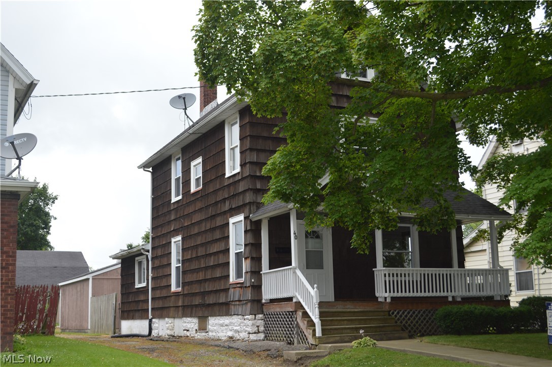 Lots of character in this 3 bedroom Colonial with a nice floor plan! You'll love the wide woodwork, large doorways, tall ceilings & spacious rooms. Great curb appeal w/covered front porch. Step into the large foyer which features ceramic tile floor & a stunning staircase. Off the foyer is the spacious living room & formal dining room w/large picture windows. The kitchen features some newer cabinets & plenty of room for a table. Also on the 1st floor is a small den/office & half bath. The 2nd floor features 2 large bedrooms & huge full bathroom. The 3rd floor is finished & features the 3rd bedroom, closet & attic access w/plenty of storage. A 2 car detached garage plus a concrete patio are located out back. Newer replacement windows, new carpet, newer ceramic tile, new screen door & brand new furnace in 2019. Don't miss out!