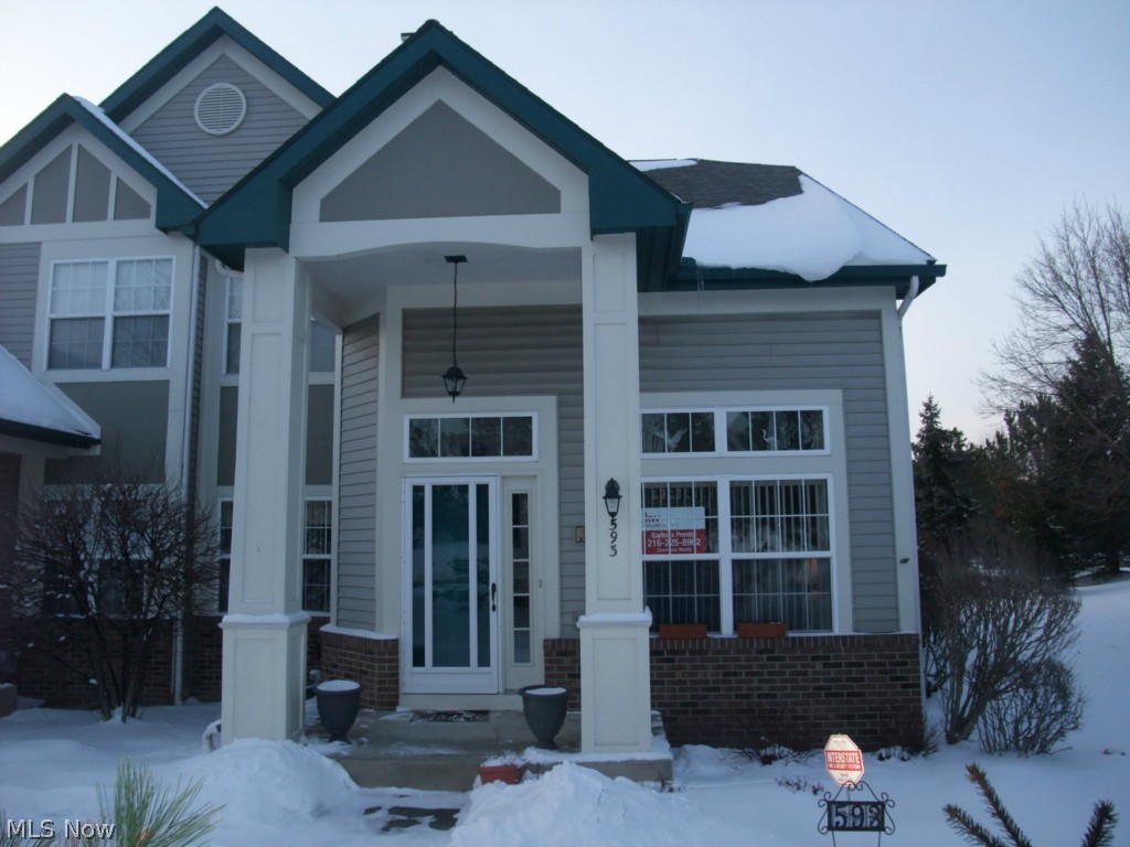 Contemporary styled end unit condo with open floor plan.  2 story living/dining room combo features gas fireplace, built-ins, plant shelf and Pallidium windows.  Fully applianced eat in kitchen with white cabinets, ceramic floors and generous counter space.  Sliders off kitchen give you access to the private patio and a nice sized private yard.  Master suite with vaulted ceilings, walk in closet  and nice sized master bath with ceramic floors.  Loft area perfect for home office or extra leisure space.  2nd bedroom on main level and the 2nd full bath.  First floor laundry/mud room has ceramic floors - washer and dryer stay.  Partially finished basement offers you a rec room and plenty of extra room for a workshop and storage.  Floored attic storage with electric.  The 2 car garage has a keyless entry and has a water spigot.  Refrigerator & dishwasher new in 2014.  Security system.  Original owners.  Former model.