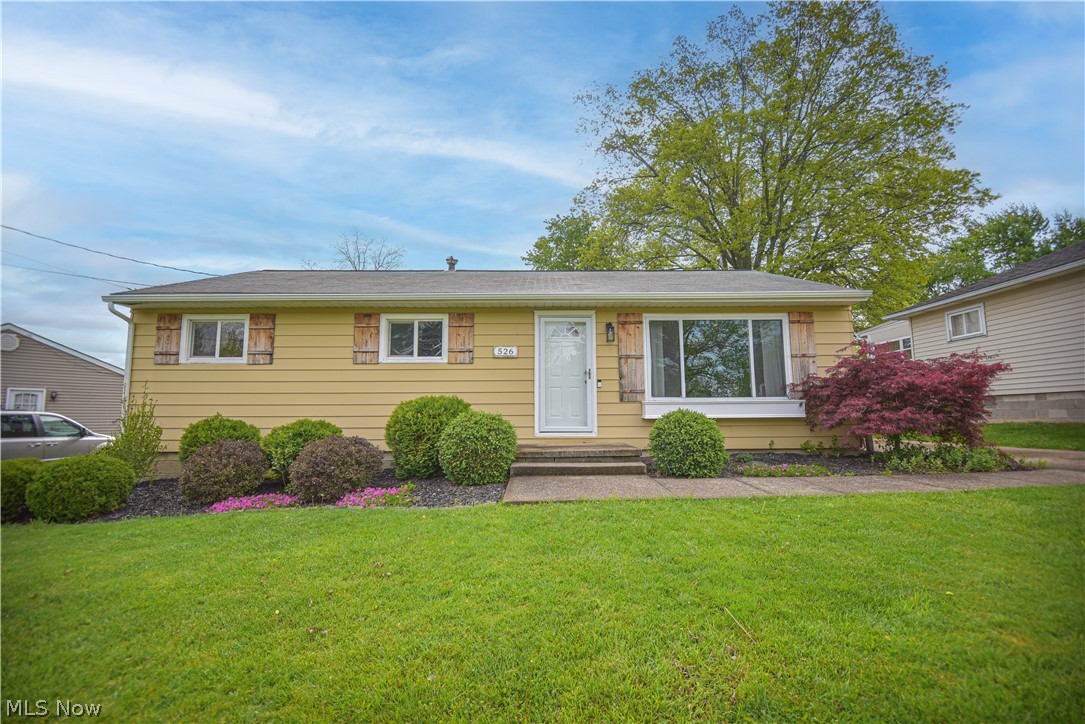 Looks can be deceiving, so you must see this one to believe it! This 3-bedroom, 2-full-bath ranch with an attached 2-car garage and a fully fenced backyard has so much to offer. Great curb appeal welcomes you in through the front door and into the living room featuring a large picture window, hardwood flooring, and a charming barn door accent on the coat closet. Beyond the living room is the dining area and kitchen with stainless steel appliances, ample cabinet and counter space, and updated lighting (2022). Just off the kitchen is a spacious family room with a cozy wood-burning fireplace (with a gas hook-up available), cathedral ceiling with skylights, and floor-to-ceiling built-in bookshelves. From the family room, step out onto the side deck or access the attached two-car garage. The opposite side of the home offers 3 bedrooms and a full bath featuring a glass block window, tile flooring, and a tile shower surround, updated vanity, mirror, and lighting. The basement provides abundant space for storage, hobbies, or additional workspace, along with the laundry area and a second full bathroom. Outside, the spacious, fully fenced backyard offers privacy while keeping pets or little ones safe. Enjoy being just a short walk from the neighborhood playground and community pool, with convenient access to local schools and Medina Square. Updates include bedroom and family room flooring (2023), HVAC (2022), closet doors in the living room and two bedrooms (2022), and updated ceiling fan/light combinations (2022). This is a must-see!