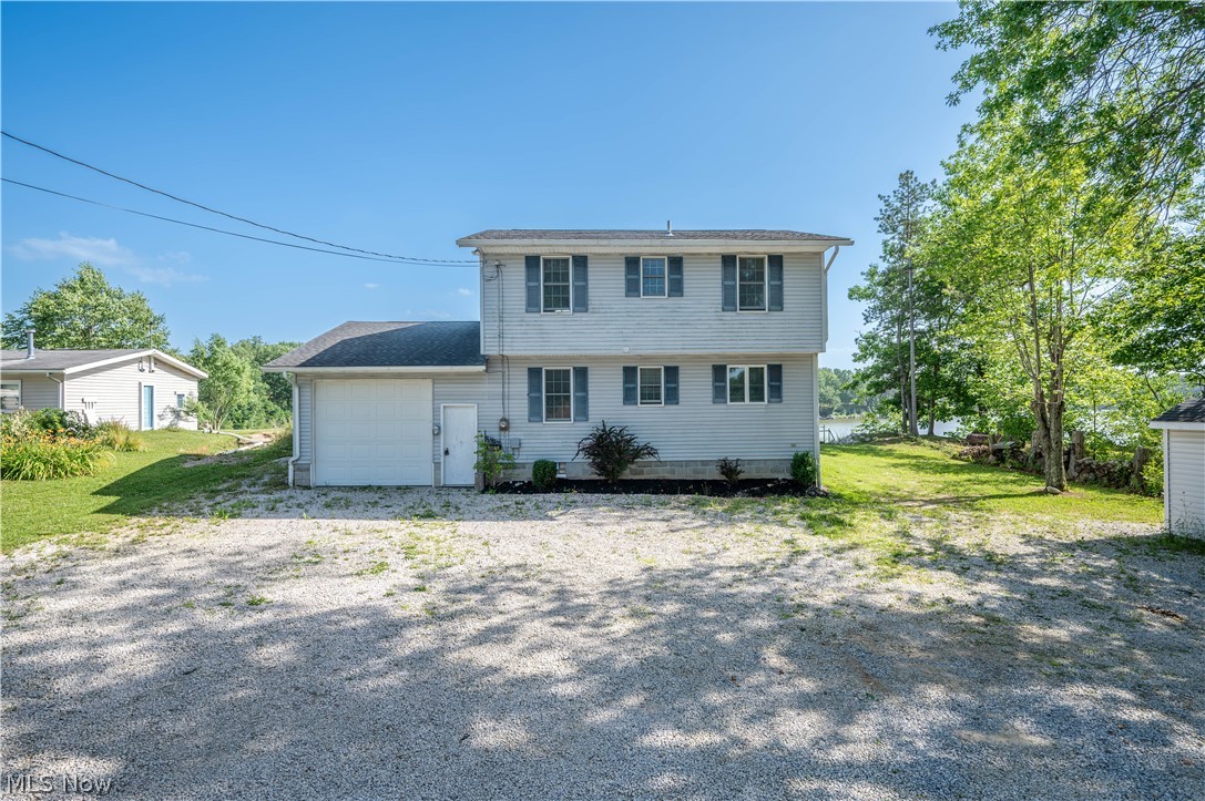 Location, location! Location! This lakefront gem could be just what you’re after. The family room greets you with soaring double-height ceilings, while the dining area offers warm wood ceilings, plush carpet, and a sliding door to the back deck. The kitchen shines with brand-new Whirlpool appliances, some still boxed. There’s also a versatile office or potential fourth bedroom and a full bath with shower. Upstairs, the master bedroom boasts a private deck with gorgeous lake views. Two additional roomy bedrooms, one overlooking the family room and lake, share a half bath. The full basement features two newer glass block windows, updated 200-amp electrical box, newer 40-gallon hot water tank, and newer stackable washer and dryer. Recent updates include a wall furnace (’24), Gutter/leaf filter (21) steps to the dock (’25), erosion control with tree removal and riprap (’25), extended driveway/parking area (’21), and a U-shaped dock with new cables (’21). One family home!! All that’s left is to enjoy the stunning sunsets! Call today for your private showing!!!