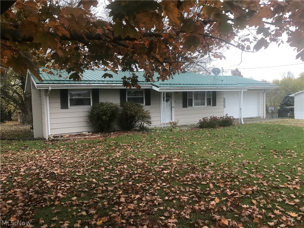 Priced to sell. This ranch home on almost level half acre. 2 car garage goes directly into the kitchen. Above ground pool has not been used in approx 3 years. Home has newer metal roof with newer gutters. Brand new 200 amp breaker box. New carpet in living room and all 3 bedrooms. Windows have been replaced with vinyl tilt in windows. Wood siding on front and back of home but newer vinyl on both sides. The bathroom has been updated in 2020 with a new floor, commode, sink and medicine cabinet. There is also a commode and shower in the basement.