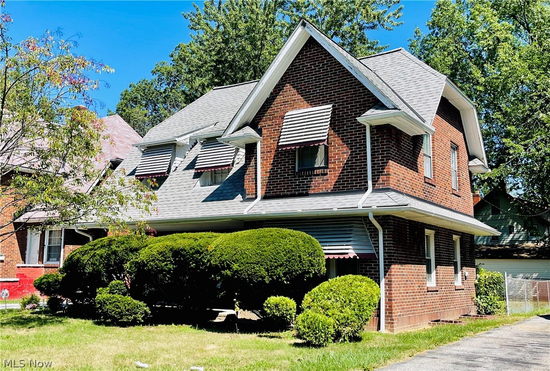 SOLID BRICK FAMILY HOME! Disability friendly with an outdoor ramp and inside stair/chair lift. Warm and inviting, this home has been occupied and HOME for generations. Almost the season to get cozy and relax by the Living Room fireplace! Three bedrooms share a large relaxing main bathroom ready for servicing a new generation! The lower level is ready to be completed and already has a powder room. The single detached garage leaves plenty of room for large fenced in family entertaining. Mature, manicured evergreens create privacy for a cozy front porch welcoming New Owners, family and visiting friends. Just in case we are caught in another winter lock-down, this home is a great place to hunker down safely and comfortably! Conveniently located! Cleveland Clinic, CWRU, University Circle, shopping, Medical offices an easy drive to Downtown CLE and MORE are all close! This home is price "as is" under $100K Nearby homes listed considerably higher! ...Priced to sell!!!! Lower taxes make for a