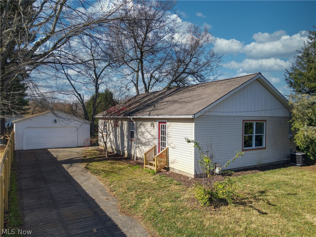 Welcome home to 8709 Hickock Ave SE Waynesburg Ohio! This 2 bedroom 1 bathroom Ranch provides complete one-level, open concept living. Upon entering the front door, you will find every inch of the home has been renovated with new flooring, appliances, fixtures, and has been freshly painted. Step up into the kitchen and notice the amount of storage space and cabinetry! Look out upon the rest of the living areas and imagine the many possibilities to arrange each space according to your family’s desires. Whether you need a larger dining area to host extended family, an area for a home office, or a designated space for your child’s play area, this home has it! Make your way down the hall and find 2 bedrooms, 1 full bathroom, and a mud room/laundry room. Outside features a partially fenced in flat yard space with a detached 2 car garage, as well as a shed. Continue to enjoy the outdoors and other activities as this home is located close to Sandy Creek, Sandy Valley Trail, Lake Mohawk and so