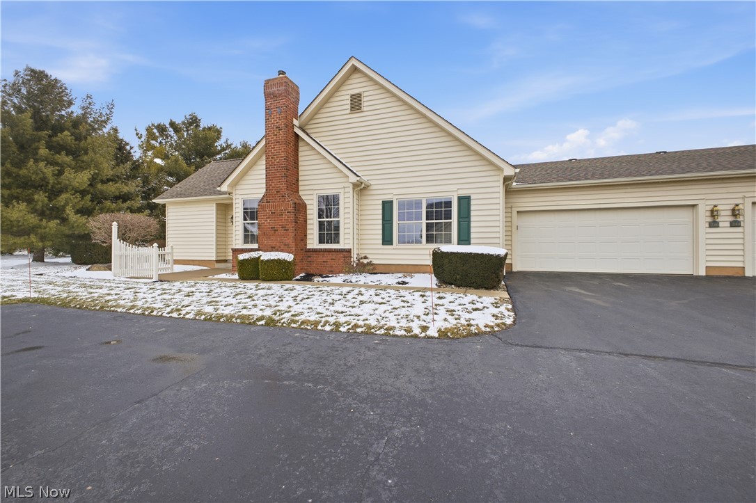 Easy one-floor living in one of the most private settings in the community! Welcome to the Village of Jamestown Trace in beautiful Columbiana, Ohio, where comfort and convenience intertwine.
This super clean, meticulously kept condo, with neutral colors, offers an open floor plan that makes you feel right at home. The living room features vaulted ceilings and a gas fireplace flanked by windows, filling the space with natural light. It opens to the dining area and kitchen, where white cabinetry and crisp white trim create a fresh, nicely updated look.
The kitchen has a breakfast bar, pull-out shelving, and all appliances: stove, refrigerator, microwave, and dishwasher. It even has a built-in ironing board tucked neatly away.
The primary bedroom offers a walk-in closet and a private bath with a tub/shower combination and a heat lamp for added comfort. The second bedroom has a double closet and access to a full bath with a step-in shower and heat lamp. Both toilets are high-rise. The first-floor laundry adds convenience.
Enjoy morning coffee on the front patio with a retractable screen door, or relax in the unheated sunroom with a wall of windows and a sliding glass door leading to a private brick paver patio. Furnace and central air were replaced in 2022, providing comfort and peace of mind.

The 2 car attached garage is heated and has a extra storage and a laundry tub with hot and cold water available.
Join this welcoming community and enjoy low-maintenance living in one of Columbiana’s most desirable condo settings.