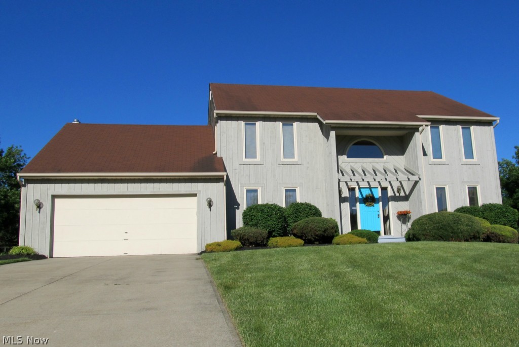 Beautiful, neutral, contemporary; den & laundry on 1st floor; impressive 2-story foyer with newer tile flooring that extends through fantastic kitchen that features granite counters, newer stainless appliances, center island, pantry, vented hood, sliding door to deck; vaulted family room, gas fireplace, newer box bay window; all 4 bedrooms on 2nd floor, master bath has newer tile floor, skylight, 2 vanities, jetted tub, & large walk-in closet, all other bedrooms have 2 closets; unfinished basement with garden windows, heated garage, sprinkler, & alarm systems.  Other recent improvements in last 2 years include furnace, hw tank, master bedroom window, garage door opener, picture window in family room.