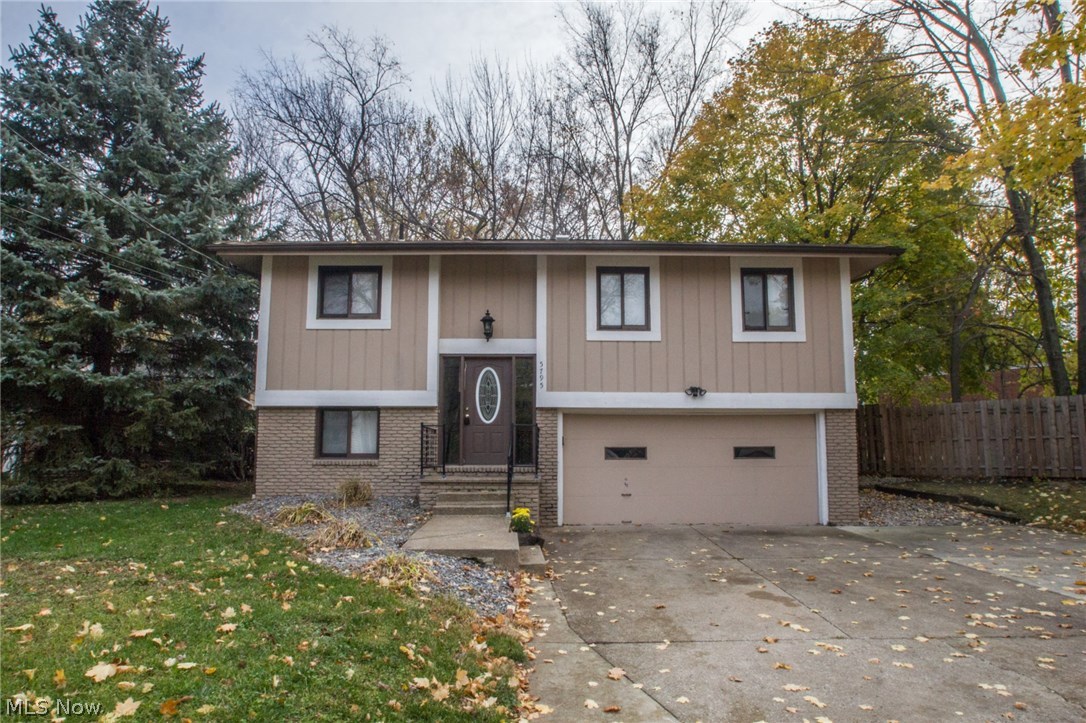 Large multi level home with 3 bedrooms and 2 full baths * Living room is open to formal dining area and patio doors to multi level enclosed deck/patio * Open kitchen with stainless appliances * Washer and Dryer stay * Lower level has family room with wood burning stove, laundry room, full bath and garage access * Furnace and C/A 2 years old * Hot water tank 3 years old * Roof 2 years old * Newer electric * Storage shed * Deck freshly stained * Attached 2+ car garage with opener * One year home warranty!  Must see this one today!