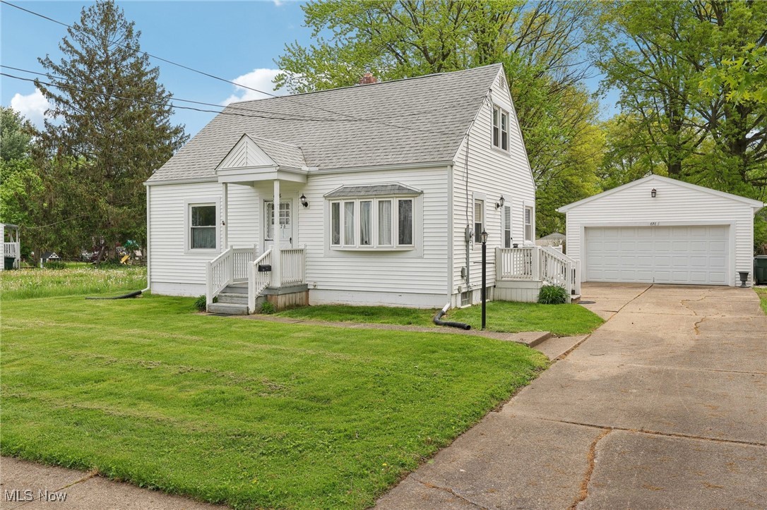 Welcome to this charming 3-bedroom Cape Cod, nestled in a quiet, well-established neighborhood and situated on a generous 65x130 fenced-in lot. This well-maintained home offers a blend of comfort and smart updates, including a new roof in 2018, updated siding, gutters, and fascia in 2017, and a two-car garage built in 2016. The main level features a bright living room, two bedrooms with hardwood floors, and an updated full bath. The efficient, step-saving kitchen includes all appliances and opens to a cozy dinette area. Upstairs, the spacious third bedroom offers a new ceiling, hardwood flooring beneath the carpet, abundant closet space, and a cedar closet. The furnace and A/C were replaced in 2013, adding to the home’s overall value and efficiency. The basement was waterproofed in 2018 and includes a partially finished area ideal for a home office or game room, with glass block windows providing light and security. This delightful home offers comfort, updates, and location—don’t miss your opportunity to make it yours!