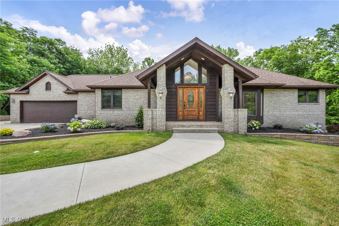 7454 Euclid Chardon Road is a custom-built single-family home offering 3,949 sq ft of total living space on 3.5 scenic acres with mature landscaping. The property includes 4 bedrooms plus a bonus room, a dedicated workout room, and a full walkout basement with entertainment area, providing a flexible floor plan with multiple finished living spaces across levels. The fully renovated kitchen features modern finishes and a brand new stainless steel refrigerator, with direct access to a deck off the kitchen for seamless indoor-outdoor use. The primary suite includes an ensuite full bath and private walkout deck. A large open-concept great room anchors the main living area. Major updates include new septic system (2022), tankless water heater (2022), furnace (2019), roof (2018), newer windows in the kitchen and bedrooms, reverse osmosis water filtration system, security system, and invisible pet fence. The home is served by city water. Central air approximately 15 years old. Outdoor features include expansive grounds, patio areas, and walkout lower-level access. Conveniently located 4.5 miles to Penitentiary Glen Reservation, 3.0 miles to Lake Metroparks Farmpark, 5.8 miles to Holden Arboretum, and 4.2 miles to Kirtland Local Schools. Don't miss this opportunity 2026!