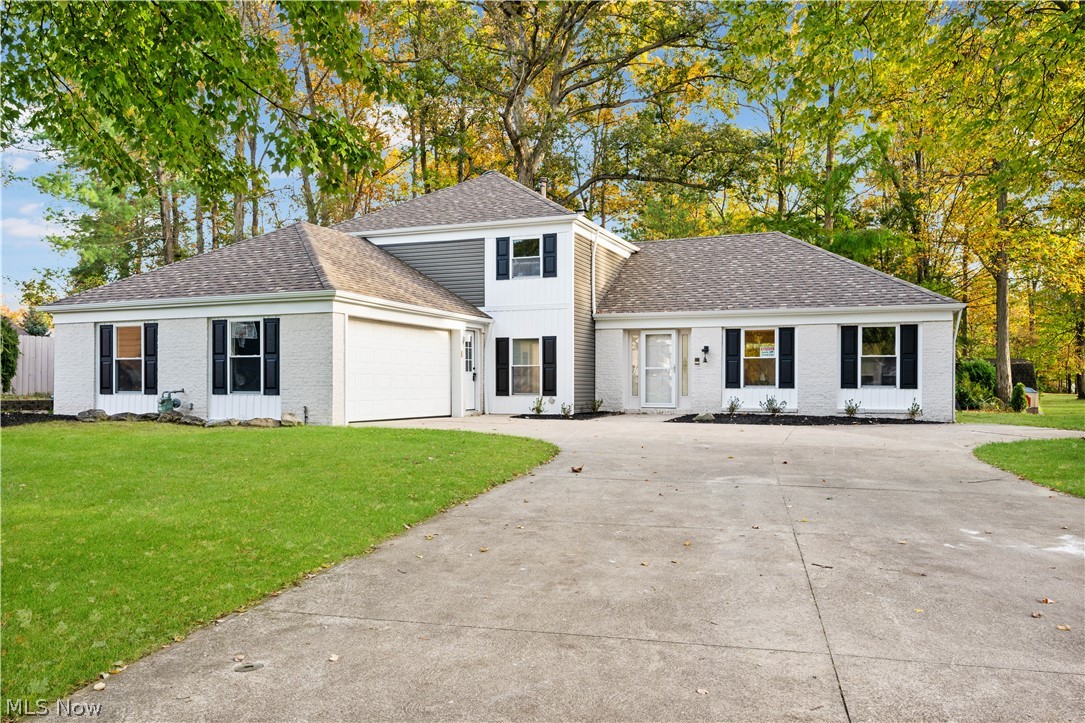 Remarkable opportunity for a spectacular home in Strongsville! Located in a quiet neighborhood, on a cul-de-sac and backing up to the park. This 4-bedroom, almost 3,000 SQFT home has been totally remade. Walk through the front door to find a family room with vaulted ceilings, a curved staircase, and a beautifully redesigned kitchen and dining room. The first floor features a fireplace, a high-end wet bar, an oversized laundry room, and a first-floor bedroom with a private patio. Upstairs, the master suite welcomes you with double doors leading to a private luxury retreat complete with dual closets, an oversized shower with two shower heads, and a double vanity. Two additional bedrooms and a full hallway bath complete the second level. The home also offers a 2-car attached garage with extra storage space, a back patio overlooking the newly planted yard, and fully updated electrical, plumbing, and HVAC systems.