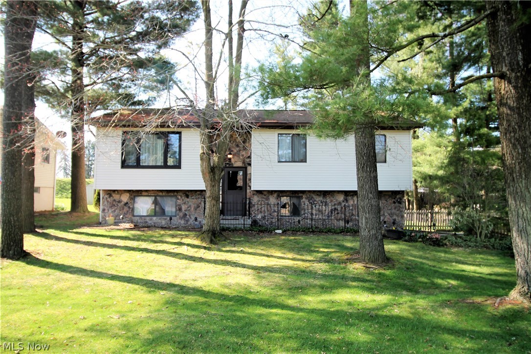 Welcome home to this charming, three bedroom, one full and  half bath bi-level home. Come on in and go up a few steps to the open floor plan featuring the living room, dining room that have sliders to the large fabulous deck to enjoy your morning coffee or to entertain, and open to the kitchen. Living room has large window to let the natural light shine through and is open to the dining room. The open kitchen has an abundant of counter space, cabinets, stainless steel fridge and stove (2019), room for a small table, there is a large window above the sink with new faucet (2019) to look out at the pristine backyard. There are three bedrooms, Jack and Jill full bathroom which was remodeled (2019) with new counters, floor, and toilet. The master suite offers sliders to the backyard to enjoy and let more of the natural light shine in. The finished lower level/family room has plenty of space to entertain, laundry room with more storage area, half bath that was remodeled (2019). There is an a