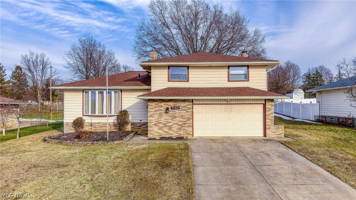 Welcome home to this well-cared-for 4-bedroom split level in Gettysburg Estates, conveniently located right on the border of Seven Hills and Parma. This home offers a great layout with multiple living spaces and room to spread out. The foyer entry includes a full wall coat closet and leads into the lower-level family room featuring a wood-burning fireplace and a convenient half bath nearby. A short set of stairs brings you to the main living area where you'll find a bright kitchen with plenty of cabinet and counter space and vinyl flooring throughout this level. The front living room features a large bay window that brings in tons of natural light and nice sunset views. Upstairs are four comfortably sized bedrooms with original hardwood floors and good closet space, along with a full bathroom. The upstairs hallway has new carpet for a fresh update. The finished basement adds extra usable space and also features new carpet, ideal for a rec room, office, playroom, or workout area. Out back, enjoy the enclosed sunroom overlooking the patio and yard. There's plenty of space for gardening, plus a shed built in 2021 for additional storage. Roof and gutters were replaced in 2022, and the home has a newer 50-gallon hot water tank. A solid, well-maintained home in a convenient location—ready for its next owner to move in and make it their own!