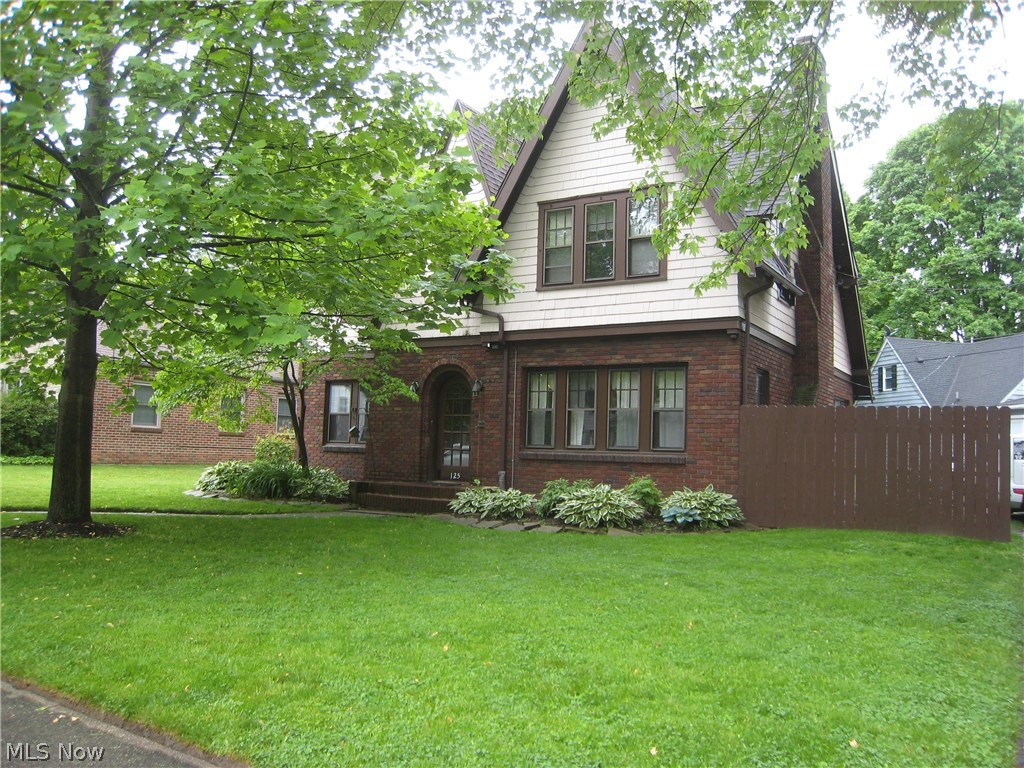 This charming Tudor home is situated in a desirable West Akron neighborhood.  The first level of the home has an inviting living room with a fire place, There is an extra room for an office or study. The home has its original hard wood floors that have been recently refinished. The formal dining room has the original wood work and so much character. There is an eat in kitchen with a breakfast nook. A half bath on the first level as well. There are 4 spacious bedrooms and 2 baths upstairs, hard wood floors and a master bath. The basement is partial finished with an extra room, could be a game room or extra bedroom. There is a 2 car attached garage. Most of the first level has ben freshly painted. Homewarranty is included.