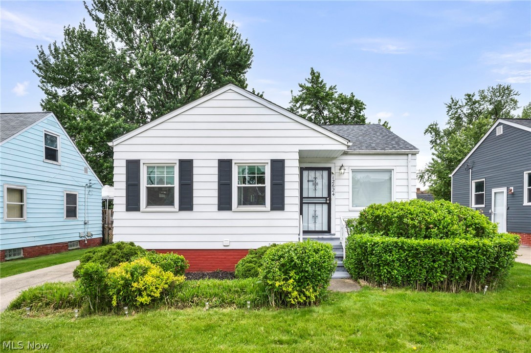 Welcome home to this move-in-ready 2-bedroom, 1.5-bath ranch offering the convenience of single-floor living in the heart of Garfield Heights. The thoughtfully designed layout features all three bedrooms and a full bathroom on the main level, providing comfort, functionality, and everyday convenience. Original hardwood floors add warmth, character, and timeless appeal throughout much of the home. Enjoy peace of mind with a brand-new roof installed in 2025 and a newer central air conditioning unit for year-round comfort. The partially finished basement provides valuable additional living space and storage, making it ideal for a recreation room, home office, fitness area, media room, or hobby space. A convenient lower-level half bath adds flexibility for family and guests. Glass block windows enhance the basement with added security, natural light, and energy efficiency. Situated in an established neighborhood, this home offers easy access to shopping, dining, parks, schools, medical facilities, and major highways, making commuting throughout Greater Cleveland simple and convenient. Whether you're a first-time homebuyer, downsizing, or searching for a well-maintained home with room to grow, this property offers the perfect combination of comfort, charm, value, and location. Don't miss your opportunity to own this inviting ranch with modern updates, additional living space, and classic hardwood floors. Schedule your private showing today!