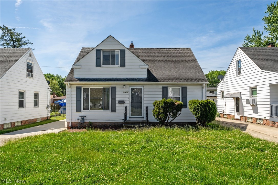 Welcome to 13410 Hathaway Rd, a beautifully refreshed Cape Cod offering the move-in-ready feel today’s buyers are looking for! This charming 3-bedroom, 1.5-bath home features 1,209 square feet above grade plus a partially finished basement with an additional 362 square feet of finished living space. Step inside to a bright and inviting living room filled with natural light, fresh neutral paint, new light fixtures, and LVT flooring that flows throughout the first floor. The stylish eat-in kitchen delivers a clean modern look with black cabinetry, gold hardware, butcher block countertops, stainless steel appliances, new appliances, and plenty of space for everyday dining. Two convenient first-floor bedrooms offer flexibility, while the updated full bathroom features a newer vanity, tub with tile-like surround, and a beautiful accent wall. Upstairs, the oversized 30' x 12' third bedroom provides incredible versatility with room for a sitting area, office space, or private retreat. The partially finished basement expands the living space with a 28' x 11' recreation room, LVT flooring, half bathroom, laundry area, and additional storage. Outside, enjoy a deep 45' x 140' lot with mature trees, green space, and plenty of room for play, pets, gardening, or future outdoor entertaining. The detached 1-car garage includes an additional bay-style storage area, perfect for lawn equipment, tools, bikes, or hobbies. Newly renovated, freshly painted, and ready for its next owner, this Garfield Heights home blends modern updates, functional space, and classic Cape Cod charm in one attractive package!
