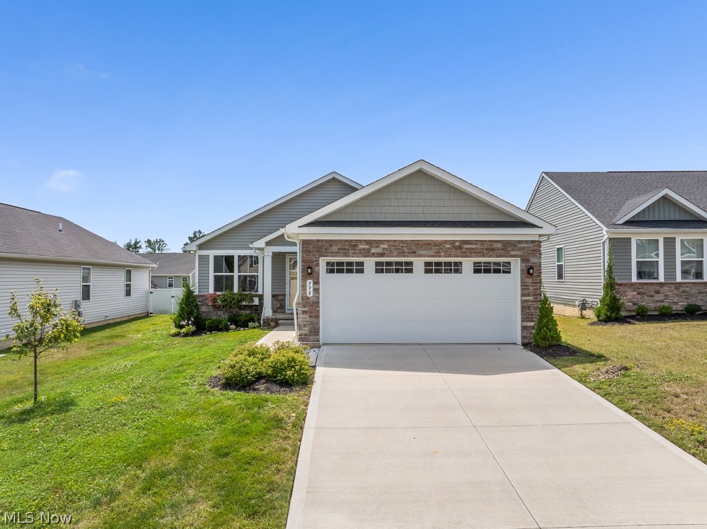 Welcome home to this beautifully maintained 2-bedroom, 3-bath home offering over 1,100 sq. ft. of comfortable living space with a 2-car attached garage! The freshly painted throughout immediately, creating a bright, inviting space that feels warm, welcoming, and move-in ready. Flowing seamlessly into the open kitchen, this layout is perfect for everyday living and entertaining alike. Just off the entry, the dining room features plush carpeting, a large picture window that fills the space with natural light, an elegant chandelier, and a stylish accent wall that beautifully complements the flooring. The kitchen is equipped with stainless steel appliances, recessed lighting, and a stunning sky-blue tile backsplash that adds the perfect pop of color. Sliding glass doors lead to your own private backyard retreat, making indoor-outdoor living effortless. A full bath on the main level is ideal for guests, while the spacious guest bedroom offers soft carpeting and a ceiling fan for added comfort. The owner's suite features a walk-in closet and private en-suite bath complete with a stand-up shower. First-floor laundry adds everyday convenience. The finished basement expands your living space with a recreation area, sliding double doors opening into the perfect movie theater room, an additional full bath with a stand-up shower, and a versatile flex room ideal for a home office, workout space, or hobby room. Enjoy the privacy-fenced backyard featuring stamped concrete, a covered patio with a ceiling fan, and immaculate landscaping that creates a peaceful setting for relaxing or entertaining. This home offers far more space than meets the eye and is ready for its next owner to enjoy!