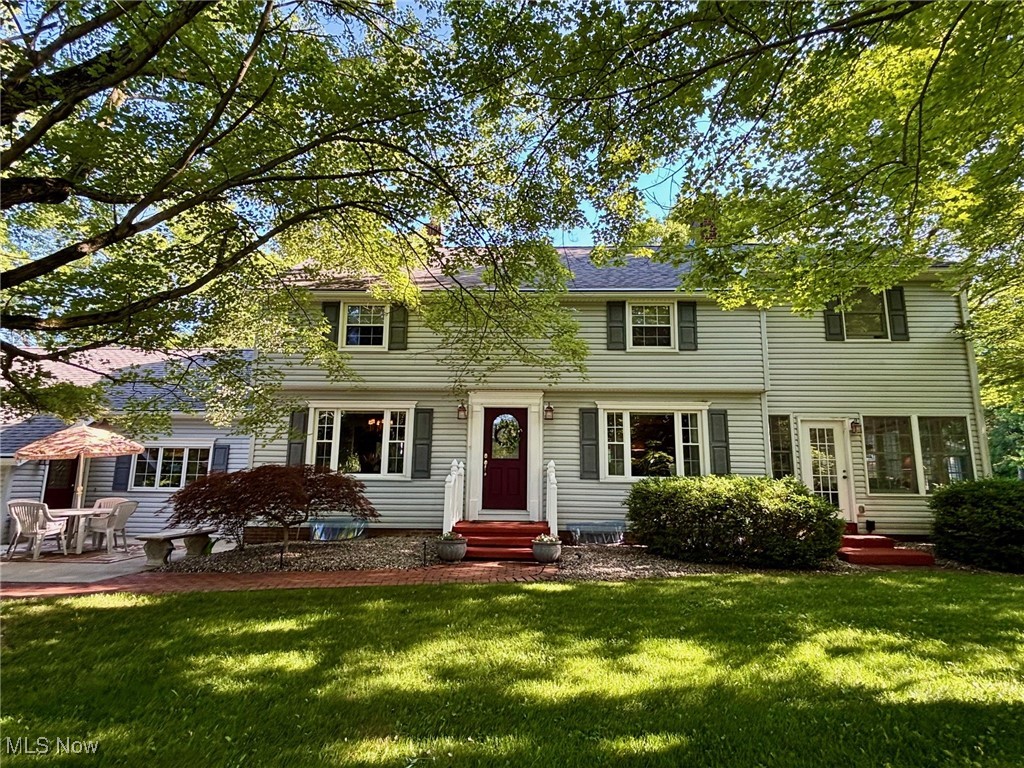 Welcome to this private 17.9-acre estate in Charlestown Township! With over 4,000 sq ft of finished living space, this home offers 4 bedrooms, 3.5 baths, with two spacious primary suites—perfect for multi-generational living.

The main-level suite features cathedral ceilings, an electric fireplace, walk-in closet, French doors leading to a patio with hot tub, plus a spa-like bath with soaking tub, separate shower, and in-suite laundry. The second-floor suite includes double closets, original oak hardwood flooring, and a large bathroom with cathedral ceiling, skylights, soaking tub, shower, linen closet, and access to a private deck—ideal for relaxing in the sun.  Two additional spacious bedrooms are located on the second floor and also feature the original oak hardwood.

The heart of the home is the kitchen, complete with stainless steel appliances, Corian countertops, island, pantry, and stunning views of the scenic property. Multiple living areas include a dining room with tray ceiling, a living room with wood burning fireplace, a family room with gas fireplace, a four-seasons room surrounded by natural light, and a finished basement with gas fireplace. The office, with separate entrance, could also serve as a fifth bedroom suite or bonus room. A heated attached 2-car garage with built-in cabinetry adds convenience.

Enjoy outdoor living with 3 patios, 2 decks, gazebo, hot tub, gas fire pit, gas grill hookup, and a playhouse. The 3-stall barn with water, electric, hay loft, and extra storage is ideal for animal lovers. Mineral rights convey with the property—no gas bill and receive gas well royalties. This home has been well-maintained and regularly serviced.  Too many updates to list but include: Main furnace (2024), Both A/C (2024), Roof (2017), and Hot Water Tank (2017). One-year home warranty included for peace of mind!