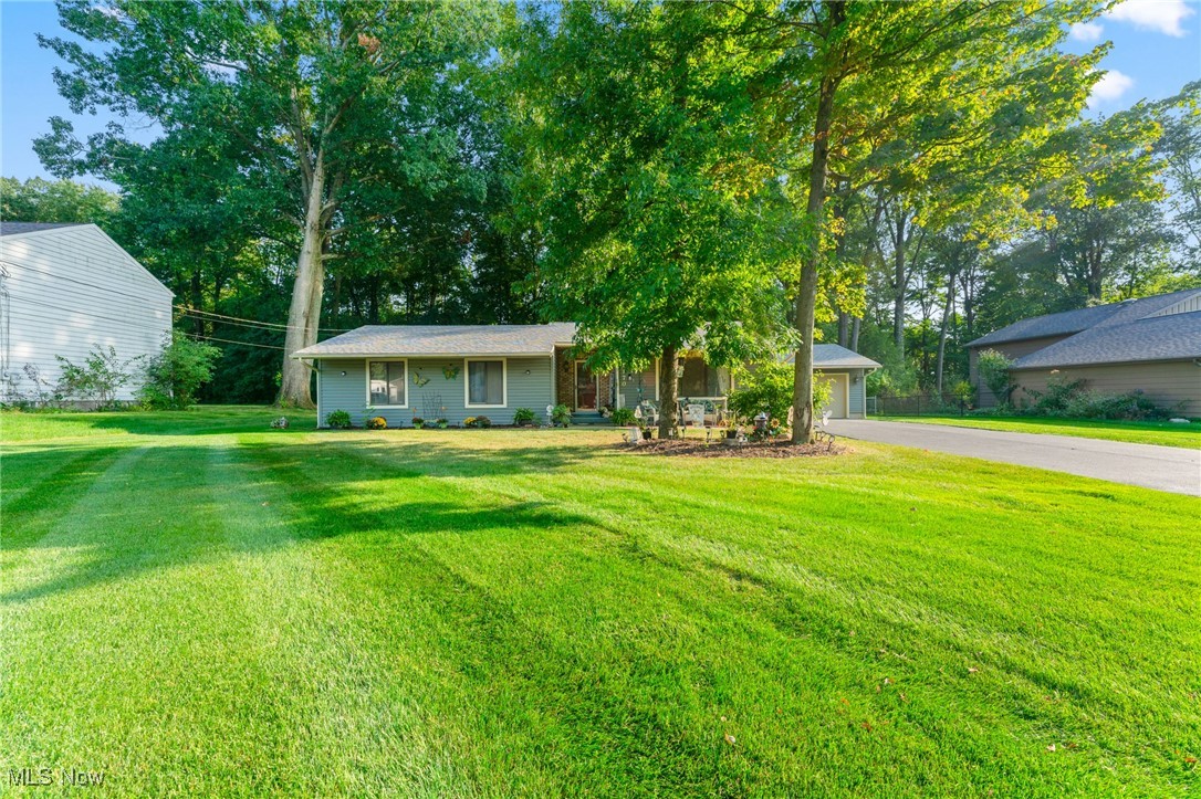 Fabulous Ranch home located in a prime location featuring 3 bedrooms and 2 full bathrooms, a full master bath and a spacious shared bathroom, open kitchen with eat-in area, all appliances and newer flooring, large bonus room off back of home, elegant dining room leading to large living room, each room with cathedral ceilings, full basement, upgrades include newer roof and beautiful vinyl siding, attached two car garage, full front porch and full back concrete and stone patio, fenced back yard, treed, recently sealed driveway, professionally landscaped, hurry, this home will not last, call today for all showings.