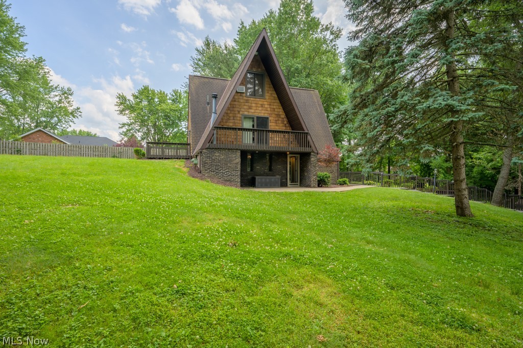 If you're looking for a unique home to call your own look no further! This is a nature lovers dream with lots of beautiful outdoor entertaining space. The home features a in-ground stone pool with beautiful landscaping surrounding it. Extra deep two car garage has a chain link fence off of it perfect if you have pets. Both bedrooms feature their own private balcony/porch and both living rooms have sliding glass doors for outdoor access and natural lighting. Top level can be used for additional living space or a 4th bedroom. Nothing but tranquility at this double A frame in Rootstown Township! Just minutes from Lake Hodgson (can be seen in photos), NEOMED, and I-76. Don't miss out on this one!
