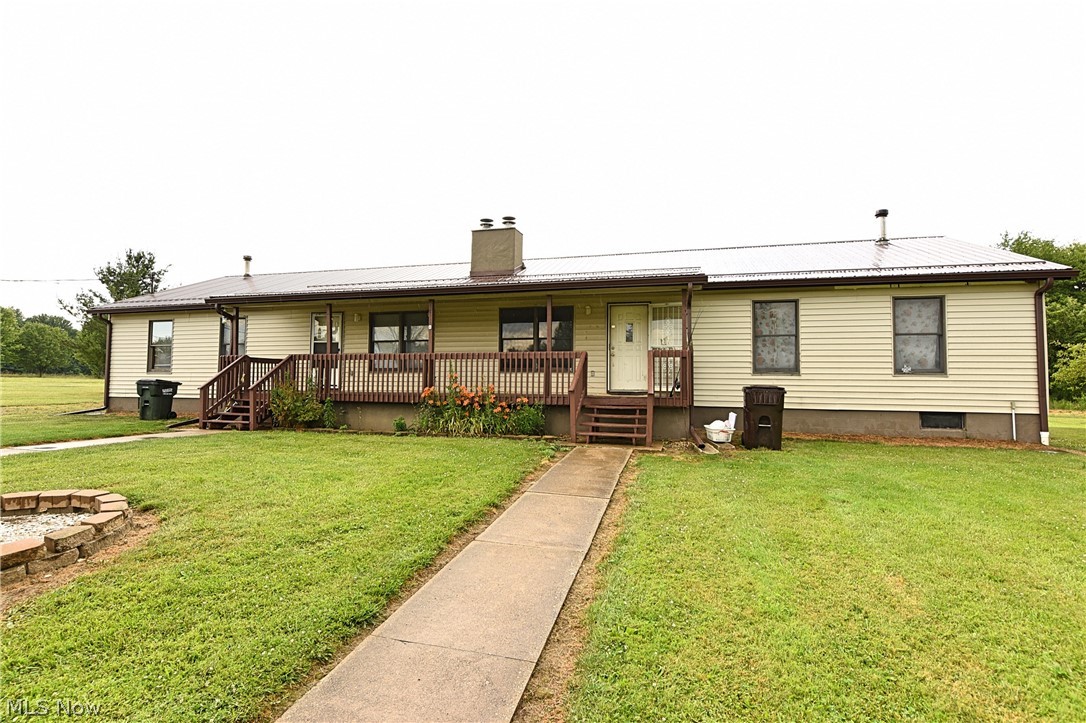Meticulously maintained duplex located in a country setting in the James A. Garfield school district.  Each unit contains 3 bedrooms, 2 full bathrooms, and a full basement underneath.  Laundry for each unit is located in the individual basements.  Each basement has been finished some, one more so than the other.  This property also contains a recently vacated 48' X 38' garage.  The garage has a roll-up door on each 38' side of the building and is partitioned in the middle.  the garage rented for $500.00 per month from 03/2020 to 03/2021.  Can easily be made to rented per side or used for personal use.  New metal roof and gutters on duplex and garage in 2020. New metal siding on garage in 2020. New sump pump and hot water tank in both units in past 3 years. New footer drains. This property is turn-key for either an investor or someone who would like to live in half and rent the other.