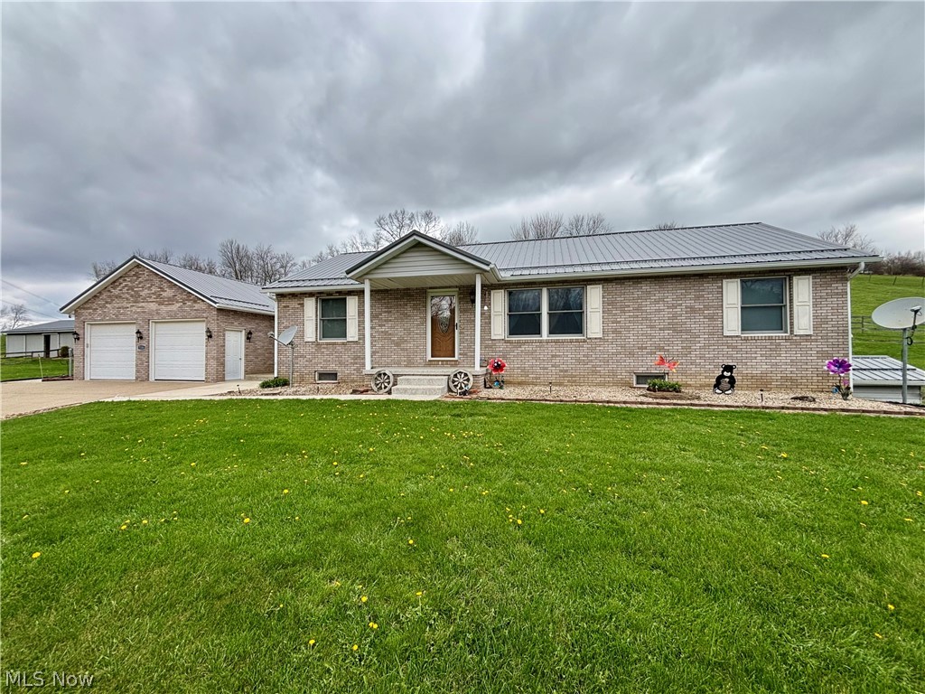 Very clean three-bedroom, two-full-bath ranch home on 9.31 acres, featuring a partially finished
basement, an extra-wide concrete driveway, and a 30’ x 70’ pole barn with two horse stalls. The
main level of the home includes an entry/mudroom from the two-car attached garage with walkthrough
access to the main-level laundry room, with a washer and dryer to transfer. The remodeled
kitchen with dining area offers granite countertops, a reverse osmosis system, and stainless steel
appliances to transfer, Pella sliding patio door leading to the rear three-season room installed by
Canton Aluminum. The main level also includes a living room, a primary suite with an attached full
bath featuring a double sink and large shower, and two additional bedrooms with hallway access to
a full bath. The living room, primary suite, and hallway received new luxury plank flooring in 2022.
The basement features a partially finished area with a very nice family room/game room and sitting
area, along with a utility room and a large storage room with walkout access. A new roof was installed
on the home in October 2021, and a new heat pump furnace, A/C, and thermostat were installed in
July 2025. Epoxy coating on the garage floor, sidewalks, and three-season room was completed in
2018. The 30’ x 70’ pole barn includes two horse stalls and a pasture, with metal installed on the
barn roof in 2019, along with a very nice limestone driveway approach to the barn. The exterior of
the home has been nicely landscaped and well-maintained.
A large generator with 13,500 starting watts, wired to the home, will transfer as well. Located in
Brown LSD and Brown Township, this home has been very well maintained and cared for.
Subsurface minerals, including gas and oil, have been previously reserved. Come check it out!