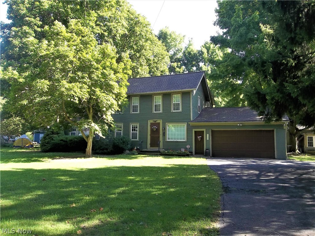 Go Back In Time!! Tour this home Historically Registered as built in 1838. This charming home of times gone-by features 4 bedrooms that include a master's suite on both the first and second floors. As you enter the front door you'll note that a parlor, dining room and kitchen all have beautiful wood floors that were just refinished. A large living room is enhanced with a fireplace and bookshelves. There are 3 and a half baths, a sunroom, a quaint country kitchen, a first-floor laundry and a 2-car attached garage. The windows have been replaced, new furnace in 2014, ac in 2015, new roofs on all buildings in 2013, and new carpet in the downstairs master bedroom. The home is ready for someone who appreciates the homes of the time period this one was built. There is a 3 room, recently remodeled cottage that has been used as a guest house. A huge old barn and a smaller out building make it even more like you are back in the 1800s. As a very special extra, is a newer 2 plus car detached gara