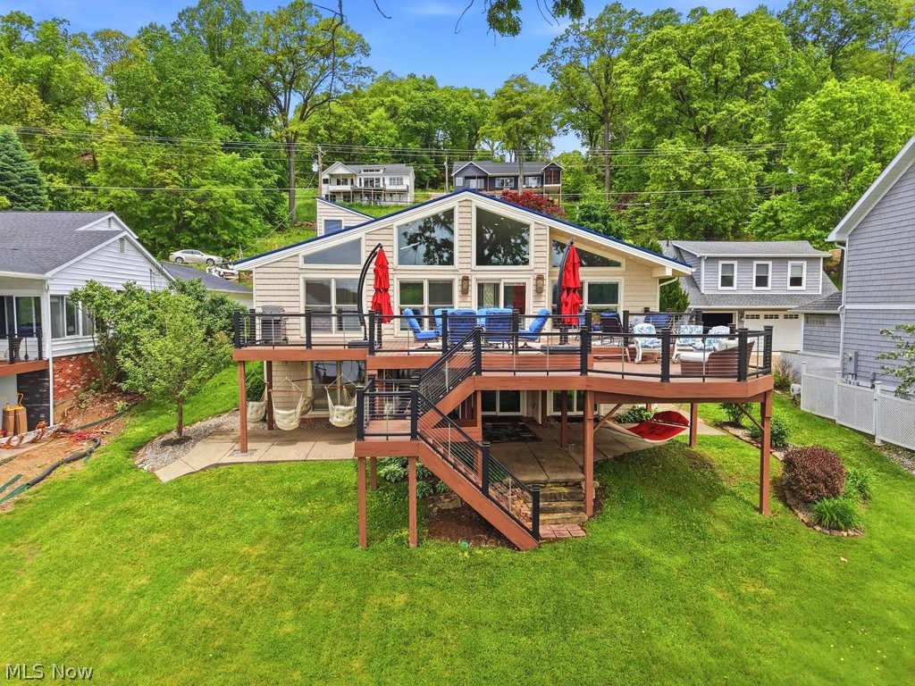 Welcome to luxury lake living at Lake Mohawk! This completely renovated lakefront retreat is packed with custom upgrades, designer finishes, and the lifestyle you’ve been dreaming of. Step through the impressive double-entry extra tall doors into a bright open floor plan filled with skylights, engineered hardwood flooring, and breathtaking lake views. The stunning Amish-built custom kitchen features soft-close cabinetry, granite countertops, induction cooktop, pantry with shelving, under-cabinet and island lighting, plus a stylish bar area complete with ice maker and refrigerator—perfect for entertaining! Enjoy Pella windows with built-in blinds and retractable screens, solid wood doors throughout, and a custom handrail leading to the lower level with illuminated stairs. The main floor offers two spacious bedrooms and a beautifully updated full bath. Downstairs, the luxurious owner’s suite includes a walk-in closet and spa-like bath with double sinks and walk-in shower, along with additional living space, beverage area, and oversized laundry room. Waterproof flooring throughout the lower level adds both style and durability. The finished 2.5-car garage is a showstopper with its own full bath and an incredible bunkroom above complete with separate furnace and central air—ideal for guests, game nights, or extra entertaining space! Additional upgrades include newer Trex deck, newer siding and windows, roof (2025), grinder pump (2025), tankless gas water heater (2026), whole house generator, two electric panels, and THREE furnaces for ultimate comfort and efficiency. Experience all that Lake Mohawk has to offer—private lake boating within a 500 acre lake, skiing, fishing, beaches, clubhouse, golf, tennis, pickleball, and a vibrant year-round community lifestyle. This is more than a home…it’s a luxury lakefront experience!