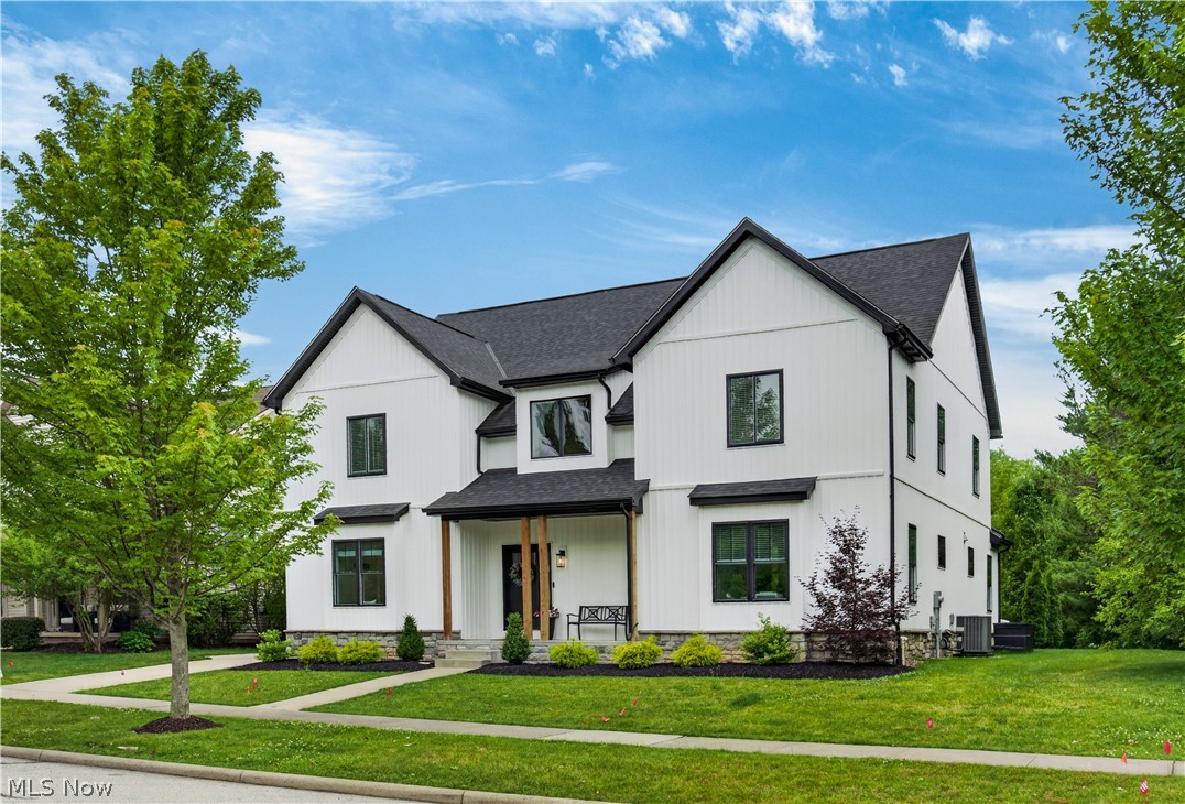 Welcome to this stunning 5 bedroom, 3 full bathroom home in Hudson, Ohio, where thoughtful design and high-end finishes come together seamlessly. As soon as you step inside, you’ll know this home is something special! The two-story foyer, which sets the tone with a grand and lofty ceiling, leads directly into a magnificent great room. The great room includes a two-story beamed ceiling, a white stone gas fireplace, and a glass slider opening to a stamped concrete patio and lush backyard. The kitchen is a true display of elegance and functionality by featuring white soft close cabinetry, quartz countertops, a four-seat center island, ceramic tile backsplash, and a full suite of KitchenAid stainless appliances, including a 6 burner gas stove. The main floor delivers on practicality and showcases a dedicated laundry room and mudroom with custom cabinetry encouraging thoughts of organizational possibilities. A fifth bedroom, or a home office if you fancy, and a full bathroom are tucked conveniently off the side hall. Moving upstairs, the primary suite features hardwood floors; a spacious walk-in closet; and a gorgeous bathroom with twin sinks, a step-in shower, and a freestanding soaking tub. Three additional bedrooms and a shared bathroom round out the upstairs level. The finished basement is a bonus and includes a home theatre with a cocktail bar, a workout and recreation space, and additional storage opportunities abound. No matter what you’re looking for, this house has it all - drop by before it’s gone!