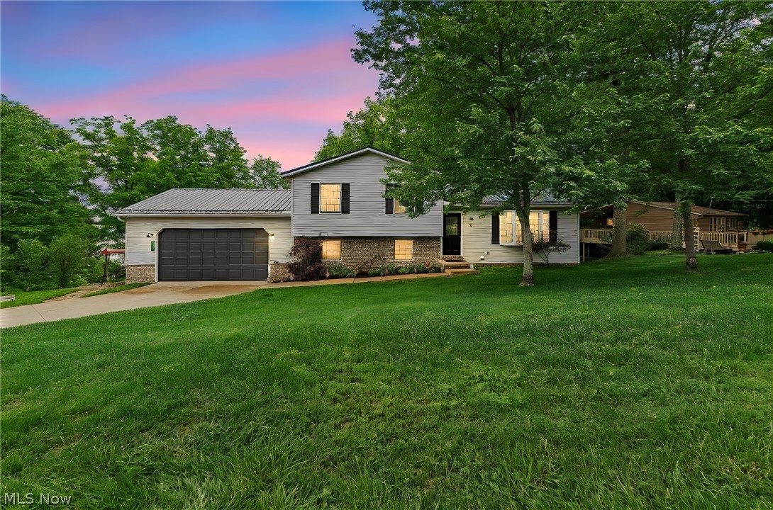 Beautifully updated 3 bedroom, 2 full bath home with year-round lake views situated on a double lot on a cul-de-sac in gorgeous Lake Mohawk! The updated kitchen is sure to impress featuring new quartz countertops and sink (2026), newer refrigerator and dishwasher (2023), can lighting, updated flooring, and a fresh modern feel perfect for everyday living and entertaining. Additional updates throughout the home include new flooring, updated lighting, new baseboards, newer trim around doors and windows, newer outlets and switches, and newer interior and exterior doors.
The spacious layout offers large bedrooms, a nice-sized dining room, bay window in the living room, oversized laundry/mud room, and a lower-level family room with high ceilings that walks out onto the deck where you can relax and enjoy the beautiful lake views year-round. The updated lower-level full bath features a walk-in tile shower, and the main bedroom offers direct access to the full bathroom.
Additional improvements include metal roof (2023), furnace (2023), central air (2023), hot water tank (2023), new railings, oversized 2-car attached garage, and plenty of parking. Pool table conveys. Need more space? The unfinished basement area could easily be finished for additional living space. Lot 534 goes all the way down to Cheyenne Trail with opportunity to open your view more if you should choose.  
Enjoy all the amenities Lake Mohawk has to offer including a private gated community with a 500-acre lake with unlimited horsepower, 3 beaches, pickle ball/tennis courts, sand volleyball courts, marina, and an Executive 9-hole golf course. Don’t miss your opportunity to enjoy lake living at its finest!