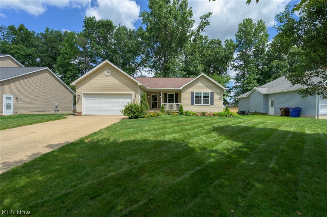 Welcome home to this beautifully maintained 3-bedroom, 2 full bath ranch in the desirable Annevar Estates neighborhood of Ravenna! Offering the ease of one-floor living, this inviting home features a spacious living room centered around a cozy gas fireplace, creating the perfect space to relax or entertain.
The thoughtfully designed floor plan includes a spacious primary suite complete with a large walk-in closet and a private bath featuring a soaking tub and separate walk-in shower, providing a true retreat at the end of the day.
Step outside and enjoy the professionally landscaped yard, filled with beautiful perennial flowers that return year after year, creating vibrant curb appeal with minimal upkeep.
Enjoy peace of mind knowing the major mechanical updates have already been completed. New windows, furnace, central air conditioning, and water heater were all installed in 2024. Additional features include city water with a water softener system and a radon mitigation system already in place.
The full unfinished basement offers endless possibilities—a blank canvas ready to become additional living space, a recreation room, home gym, workshop, or whatever suits your lifestyle.
Located in a quiet, established neighborhood with convenient access to shopping, dining, parks, and major roadways, this move-in-ready home combines quality updates, thoughtful features, and room to grow. Don't miss your opportunity to make this exceptional Annevar Estates ranch your new home!
