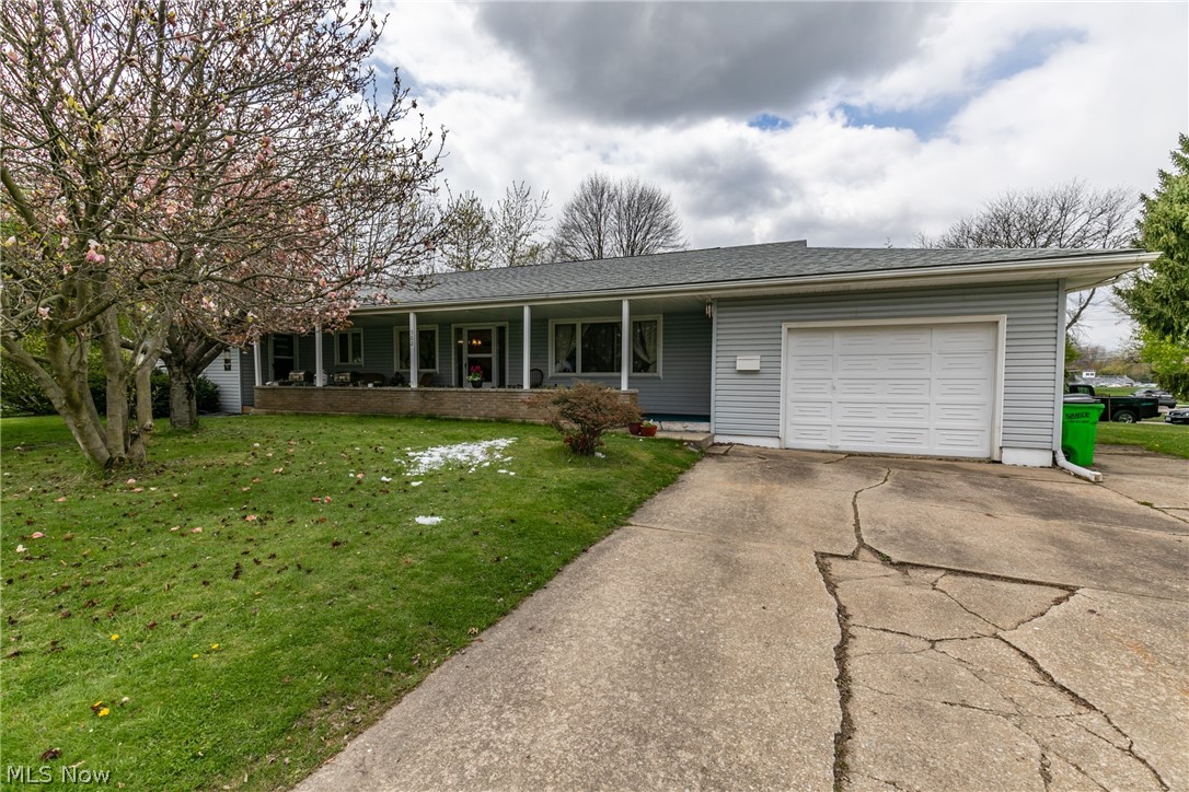 A spacious 1700+ square foot ranch in Barberton with 3 bedrooms and 2.5 baths.  This lovely home features a formal living room, formal dining room, and a family room with a fireplace.  Natural hardwood floors flow throughout the living room, dining room, bedrooms, and hallway.  There is also a full basement, attached garage, large front porch, and so much more.