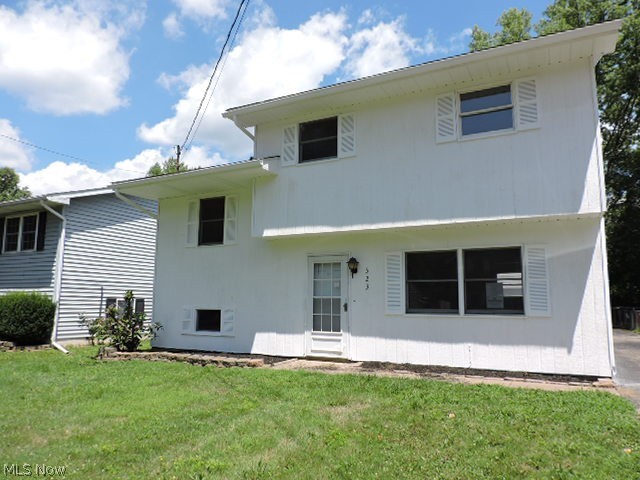 Frame and alum split level home. First floor living room and laundry/ mud room. Kitchen/ dining on 2nd floor and 3 bedrooms and full bath on 3rd level. Partially finished room on lower/ basement level. 2 car detached garage and paved drive.