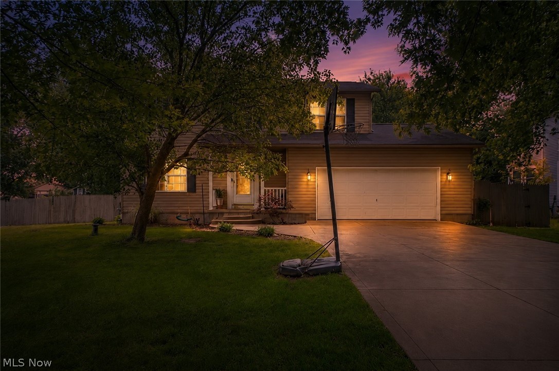 Enjoy a peaceful setting, spacious layout, and incredible outdoor space in Uniontown. Located in Lake Local Schools, this 4-bedroom, 2-full-bath home offers 1,668 total finished square feet and sits on a generous 0.46-acre lot with tons of parking, a fully fenced backyard, and plenty of room to relax or entertain. A covered front porch welcomes you inside, where the entry leads into a bright, comfortable living room with updated LVT flooring, fresh paint, and large picture windows that fill the space with natural light.

The living room flows into the eat-in kitchen, offering ceramic tile flooring, black stainless steel appliances, ample dining space, and a sliding glass door that opens directly to the oversized back deck. Whether hosting summer gatherings, enjoying quiet evenings outside, or keeping an eye on backyard activities, this layout makes indoor-outdoor living easy. A full bathroom with a shower completes the main level.

Upstairs, you’ll find four comfortable bedrooms, including a spacious primary bedroom with two closets and direct access to the shared full bathroom. The additional bedrooms provide flexibility for family, guests, office space, or hobbies. The finished lower-level recreation room adds even more living space and is perfect for a media room, playroom, workout area, or casual hangout space. The lower level also includes an unfinished utility and storage area with washer and dryer hookups.

Outside, the backyard is designed for entertaining and everyday enjoyment with a large deck, playground, fire pit area, large shed/garage, and an above-ground pool that is ready for its next owner to repair with a new wall and liner. With updated flooring and paint throughout, a great neighborhood setting, and a backyard made for gathering, this home offers comfort, space, and opportunity inside and out!