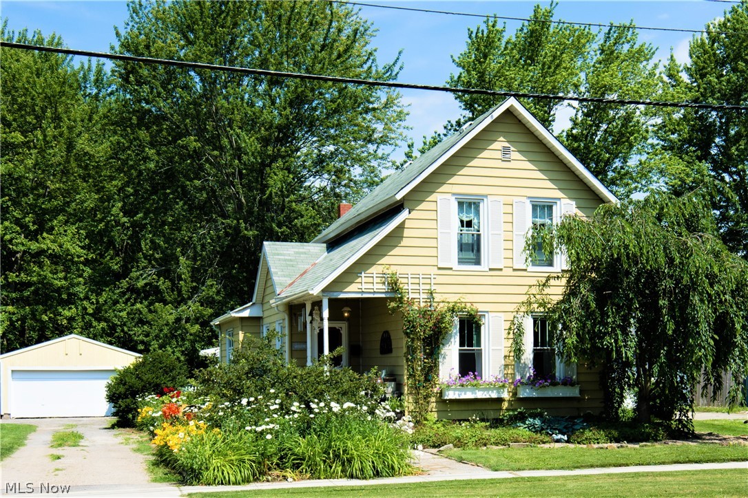 This adorable home is located in the Village of Grafton on almost a half acre lot.  The charm of this home will draw you in!  Lots of perennials line the walk to the front porch,  through the front door you enter into the large open living room and dining room. The country kitchen has  space for a breakfast table, from there you can step down to the utility room and laundry room.  The master bedroom and updated full bath are on the first floor. At the front of the home is another room that can be used as a bedroom or an office area.  Upstairs features 2 bedrooms and an attic area that could be finished as a walk-in closet. The basement has sandstone and Dutch walls.  There is a shower and toilet room down there that has not been used for many years.
Outside you have your own quaint pool house with a 15 x 12 trex deck plus a  pathway leading to the above ground pool with a large deck.  No neighbors behind you, the lot backs up to a field. So you get to have a piece of country in the ci