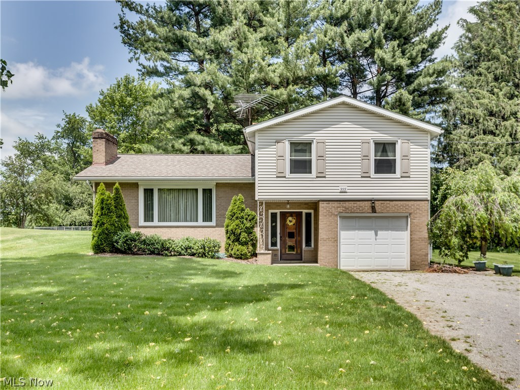What an opportunity!  Move in and enjoy or update to your own preference.  This spacious split level offers a formal living room that features a vaulted ceiling and wood burning fireplace, an eat in kitchen that includes all appliances (fridge and stove are stainless steel), and a dining room with a slider to the patio. Natural sunlight from the huge picture window accentuates the gleaming hard wood flooring. There are 3 large bedrooms and a bathroom with double sinks on the second level.  The 4th bedroom is located on the main level and could also be used as  extra living area.  The partially finished basement features a wood burning fireplace.  Updates in 2007 include roof, windows, septic and vinyl siding.  The hot water tank was recently installed.  The 100x300 yard is partially fenced and gives you plenty of room for outdoor activities. Don't miss the chance to preview this great home.  Call for your private showing today.
