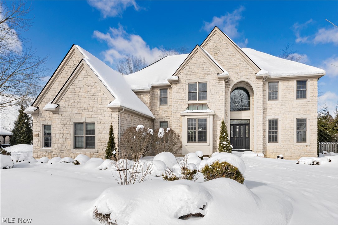 Welcome to an extraordinary residence where timeless sophistication meets modern luxury. Completely remodeled from top to bottom, every inch of this home has been thoughtfully curated with high-end finishes and exceptional attention to detail. A grand two-story foyer makes a striking first impression, flowing seamlessly into a dramatic two-story family room highlighted by a floor-to-ceiling stone fireplace. The open-concept layout leads to a stunning designer kitchen featuring premium appliances, custom cabinetry, and an expansive island designed for both elevated entertaining and everyday living. The main level offers unmatched versatility with a private office featuring direct access to a full bath—ideal for guests, multigenerational living, or a first-floor suite option. Formal living and dining rooms provide elegant entertaining spaces, while a stylish powder room, spacious laundry room, and custom mudroom with built-in cubbies add both beauty and function. A three-car garage completes the main level amenities.
Upstairs, the primary suite is a true retreat. The spa-inspired bath is grand in scale with luxury finishes and an extraordinary walk-in closet that rivals custom boutique dressing rooms. Three additional generously sized bedrooms offer comfort and privacy. The finished lower level is designed for entertaining, featuring a spacious recreation room, full bath, and a beautifully appointed wine cellar. With a brand-new roof (Summer 2025) and impeccable move-in-ready condition, this home delivers elevated living at its finest. Located in the award-winning Solon School District, this is refined luxury without compromise.