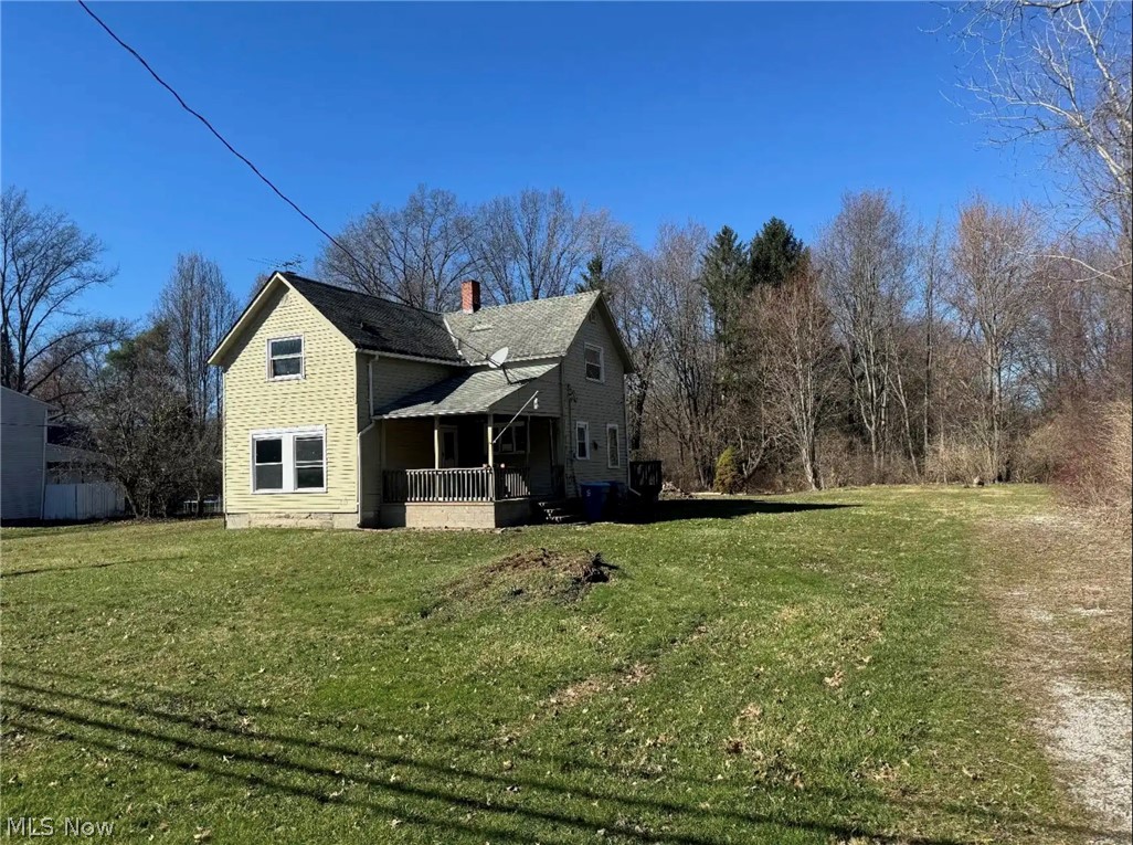 Calling all investors! This Colonial home in Olmsted Township offers a great opportunity to restore and reimagine a property with tons of potential. Situated on a spacious 4.69-acre lot, the home features a charming front porch, a cozy brick fireplace, and a back deck overlooking the expansive property. With the right vision and updates, this home could be transformed into something truly special in a highly desirable location. Being sold as-is.