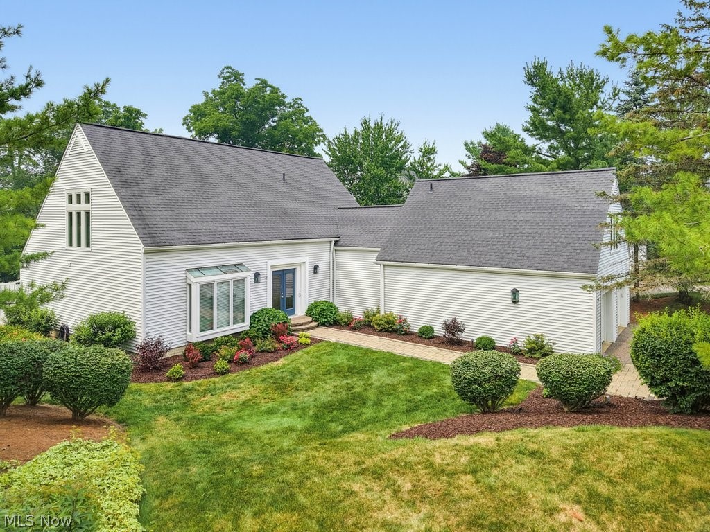 This exceptional property in Arrowood of Walden Farms is a meticulously maintained, freestanding condominium showcasing elegant, low-maintenance living with thoughtfully designed spaces! A dramatic, custom two-story stone fireplace anchors the light-filled, open-concept living space, while a wall of sliding glass doors frames views of the private outdoor setting. The kitchen includes LG appliances, granite countertops, and a large dining area with seamless access to the outdoor living space. The beautiful outdoor retreat, surrounded by lush landscaping, features an expansive paver patio with a granite-top island, new TimberTech deck, new vinyl fencing, and new Sunbrella retractable awning. This is the ideal space for private relaxation or entertaining friends and family. The main floor primary owners’ suite offers a large private refuge that easily accommodates a king-sized bedroom set and opens to a spa-inspired bath, complete with soaking tub, heated travertine floors, walk-in closet and private water closet. Upstairs, the spacious loft provides additional flexible living space. The second floor bedroom suite includes a walk-in closet and a light-filled, spa-like bath with soaking tub and recently updated tiled shower – there is even an inset non-fogging mirror! Down the hall is a third private bedroom with a dedicated full bathroom. The two-car garage is equipped with an EV charger and Nature Stone flooring. Off the hallway from the garage are the laundry room, half bath and stairs leading down to the lower level which has 700 sq ft of partially finished space providing further versatility for recreation, fitness, storage or workspace. Some of the additional enhancements include Pella windows (2021), Anderson patio sliders and Front Doors (2018), whole house audio system/Bose speakers, central vacuum, new garage doors (2024) Enjoy low maintenance convenience without compromising on luxury in one of the area’s most desirable communities!